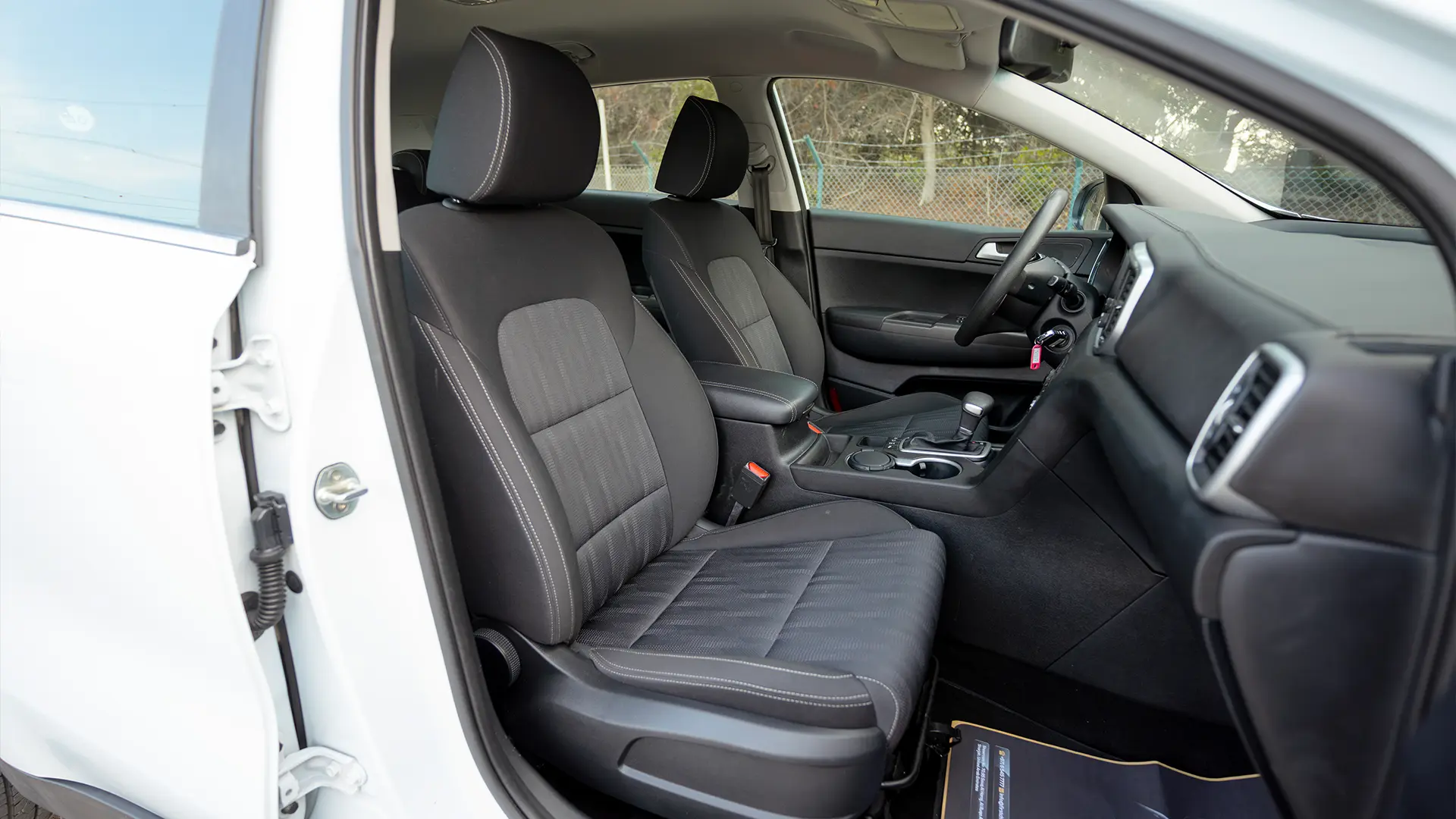 Used 2020 Kia Sportage LX in White – Front Passenger Side Cabin View for Sale at First Choice Cars Dubai Sharjah