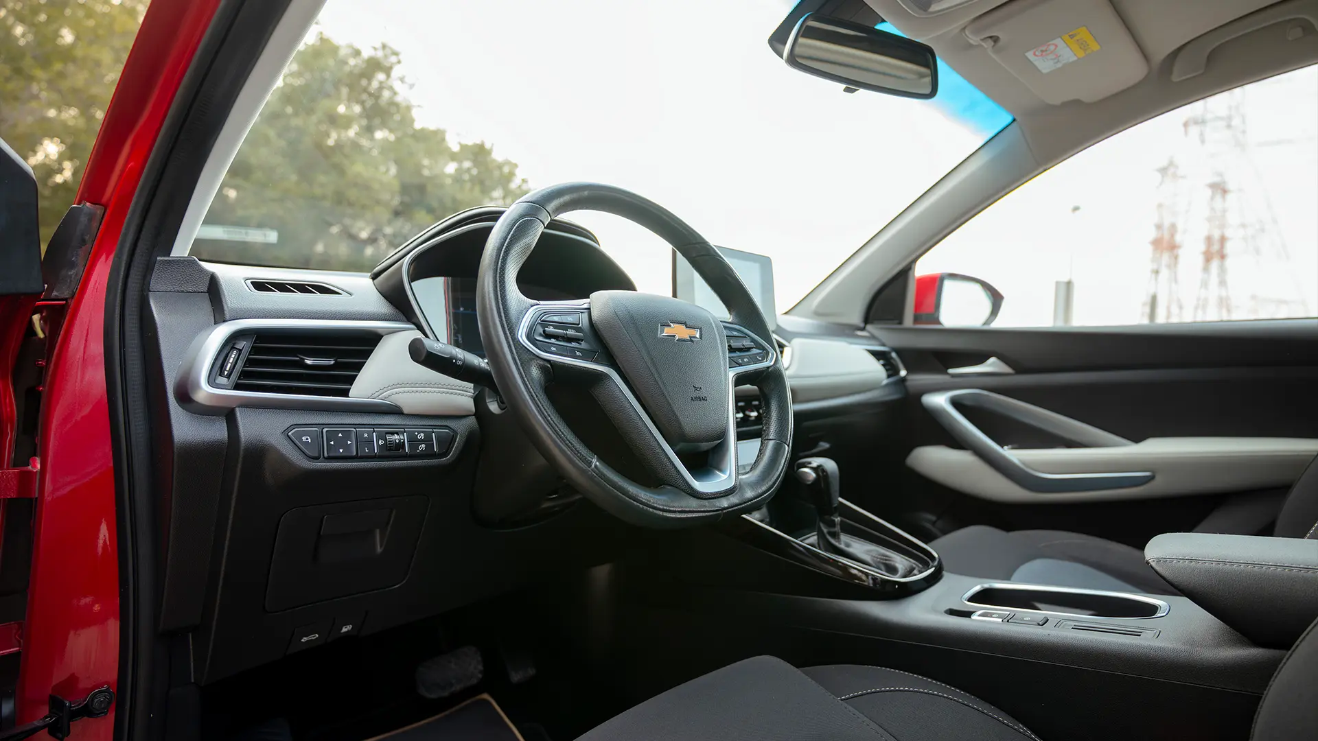 Used 2023 Chevrolet Captiva Premier in Red – Driver Side Dashboard & Steering View for Sale at First Choice Cars Dubai Sharjah