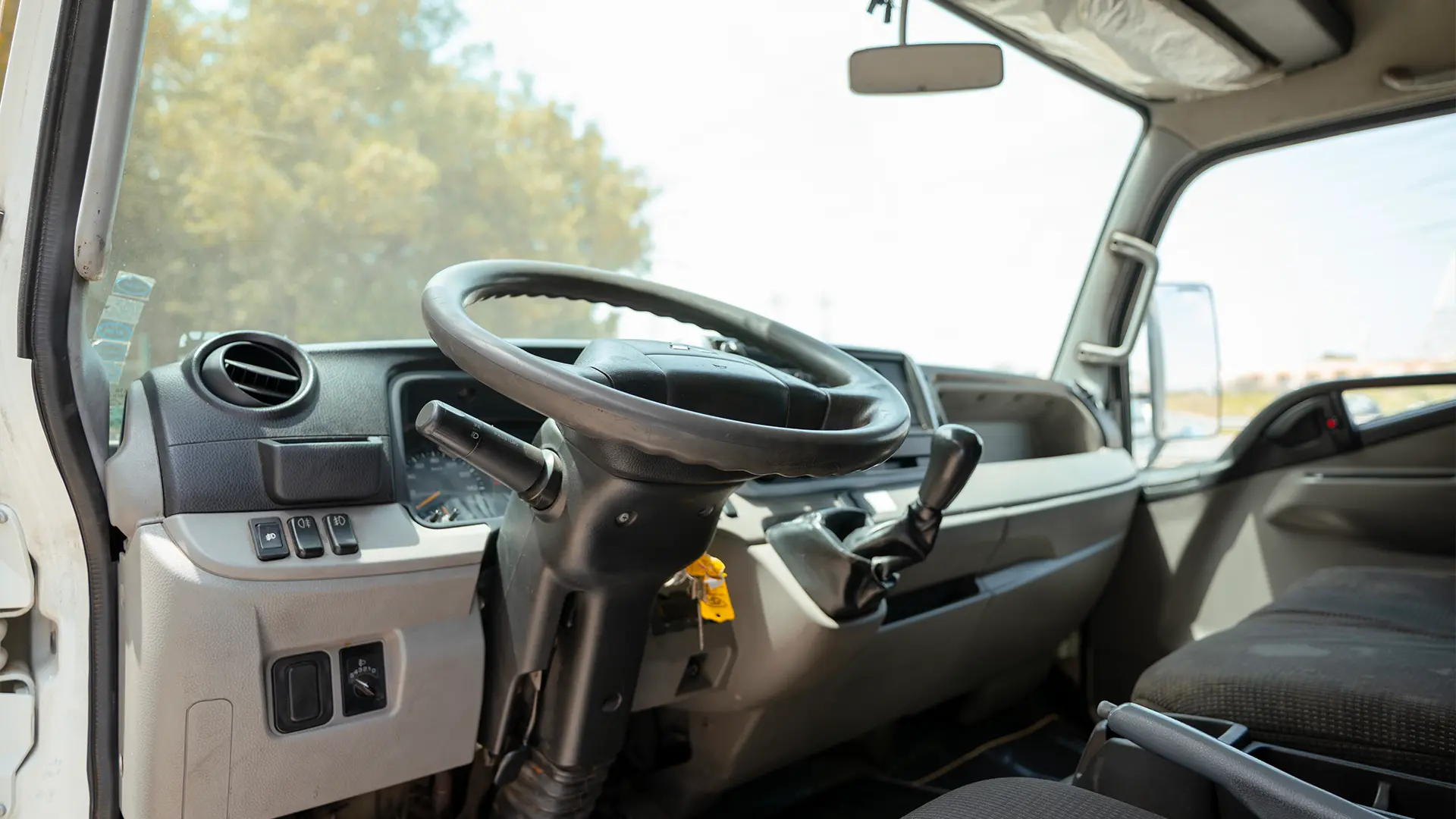 Used 2020 Mitsubishi Canter Chiller Box in White – Driver Side Dashboard & Steering View for Sale at First Choice Cars Dubai Sharjah