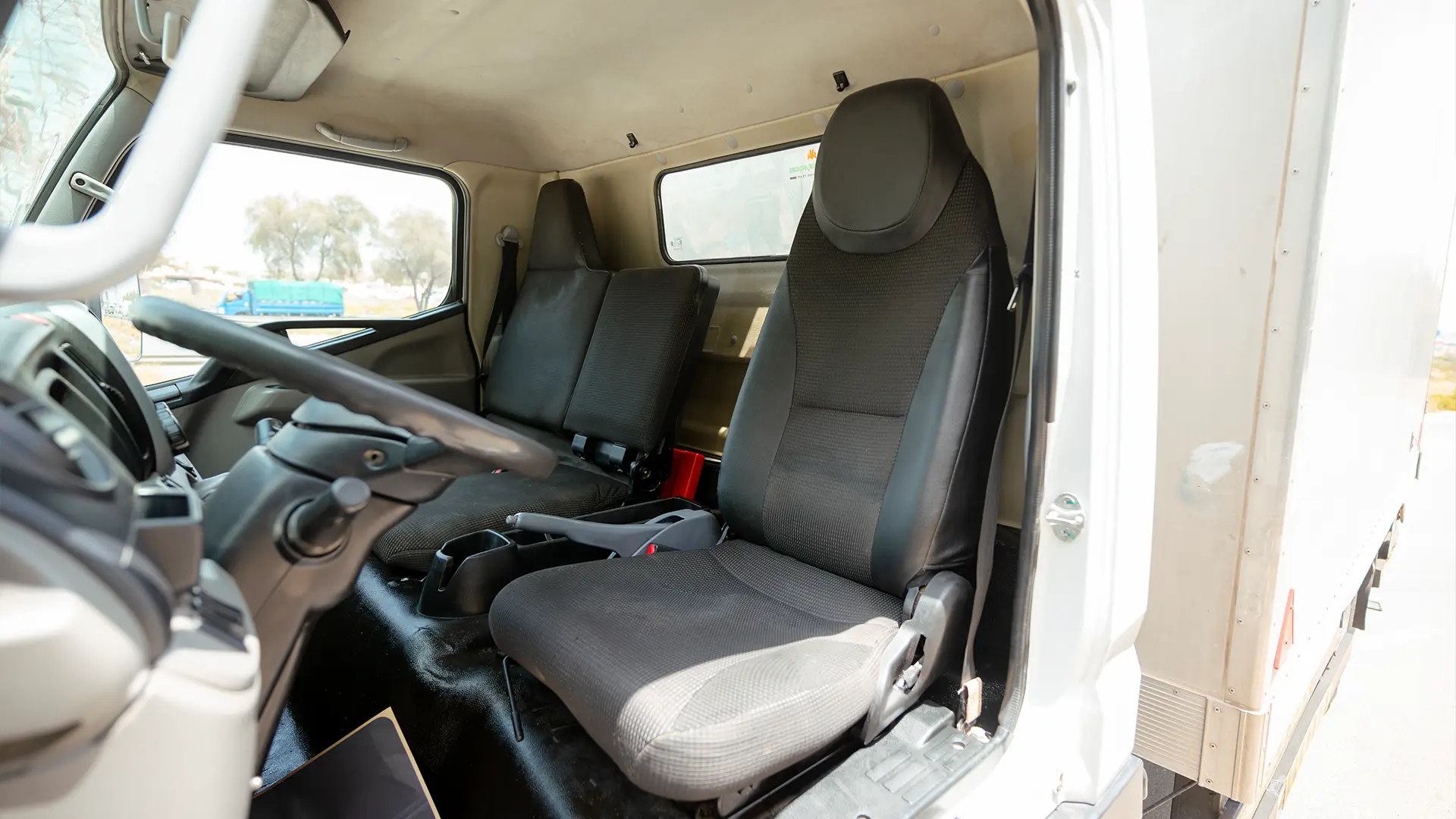 Used 2020 Mitsubishi Canter Chiller Box in White – Front Driver Side Cabin View for Sale at First Choice Cars Dubai Sharjah