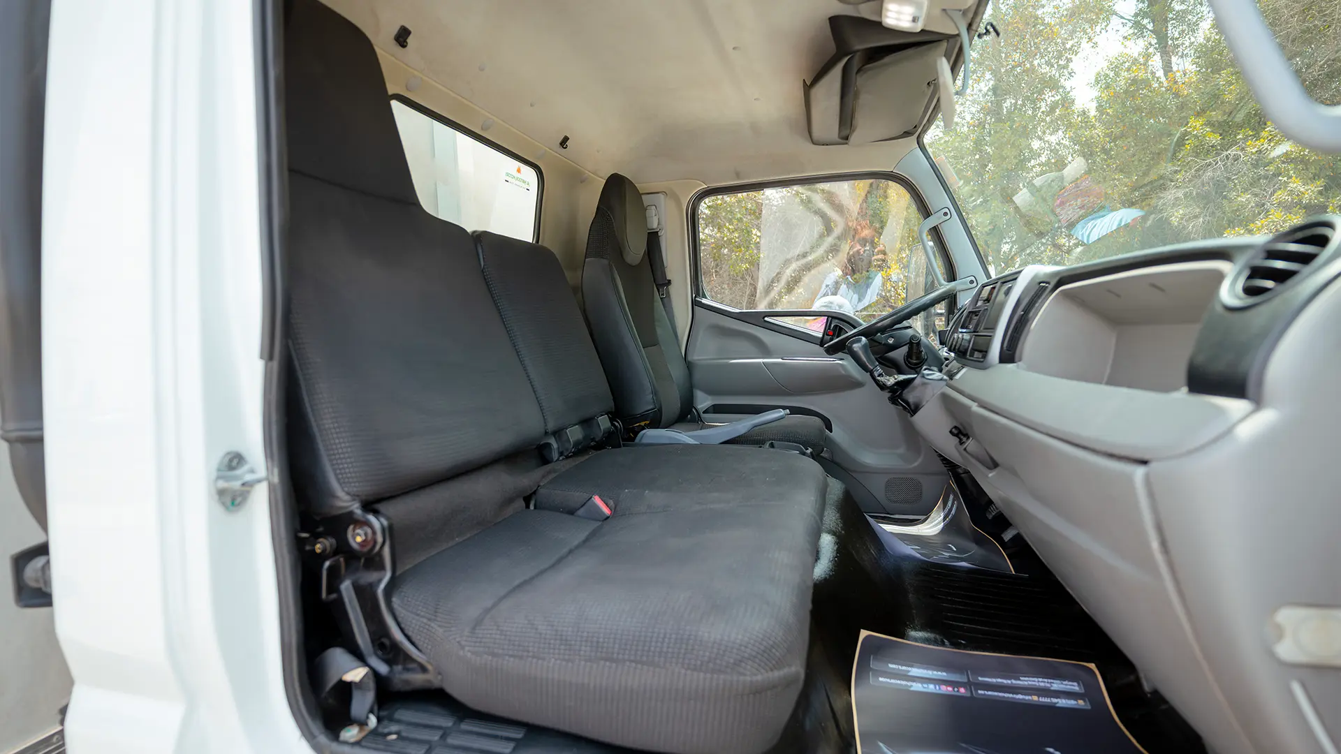 Used 2020 Mitsubishi Canter Chiller Box in White – Front Passenger Side Cabin View for Sale at First Choice Cars Dubai Sharjah