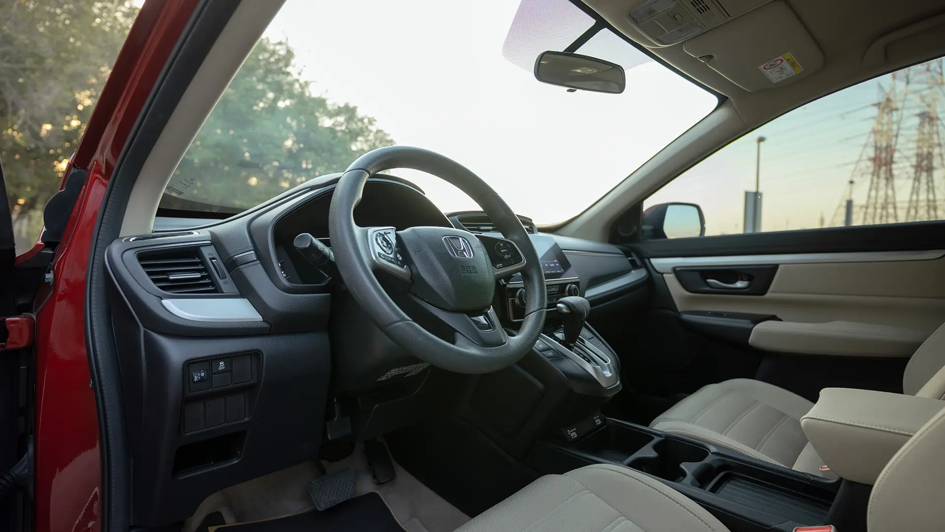 Used 2021 Honda CR-V LX in Red – Driver Side Dashboard & Steering View for Sale at First Choice Cars Dubai Sharjah