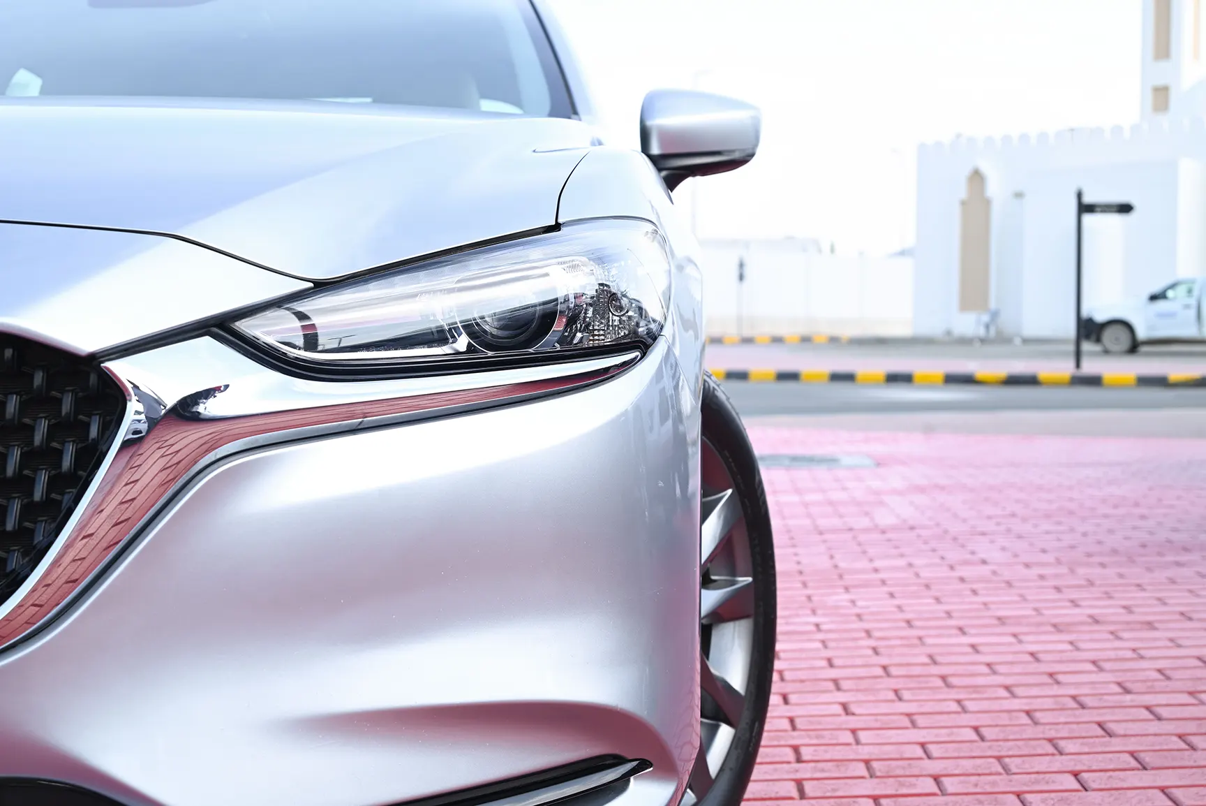 Used 2019 Mazda 6 S Grade Silver – Headlight Close-up at First Choice Cars Sharjah