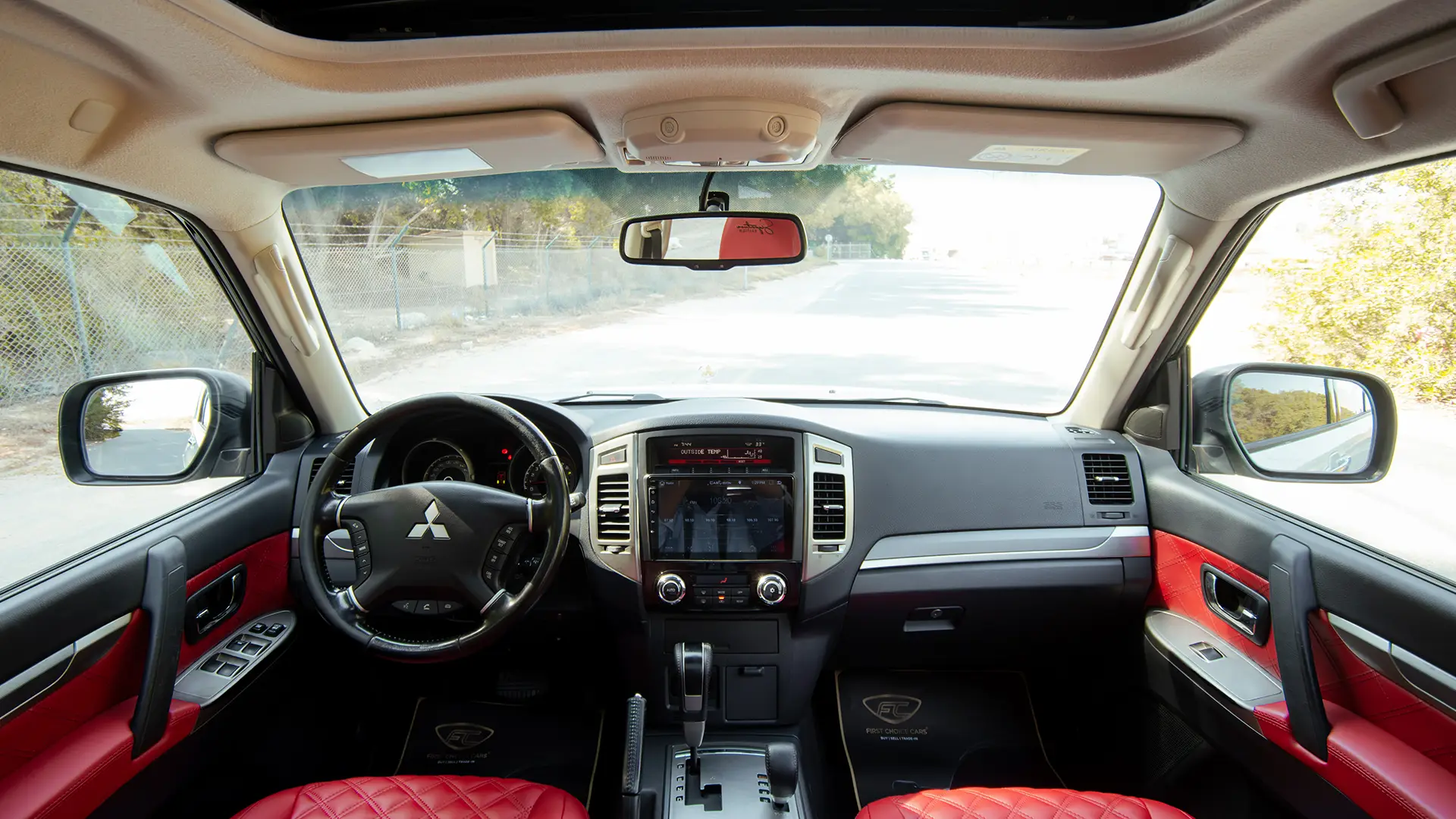 Used 2022 Mitsubishi Pajero GLS in White – Front Cabin / Dashboard Full View for Sale at First Choice Cars Dubai Sharjah