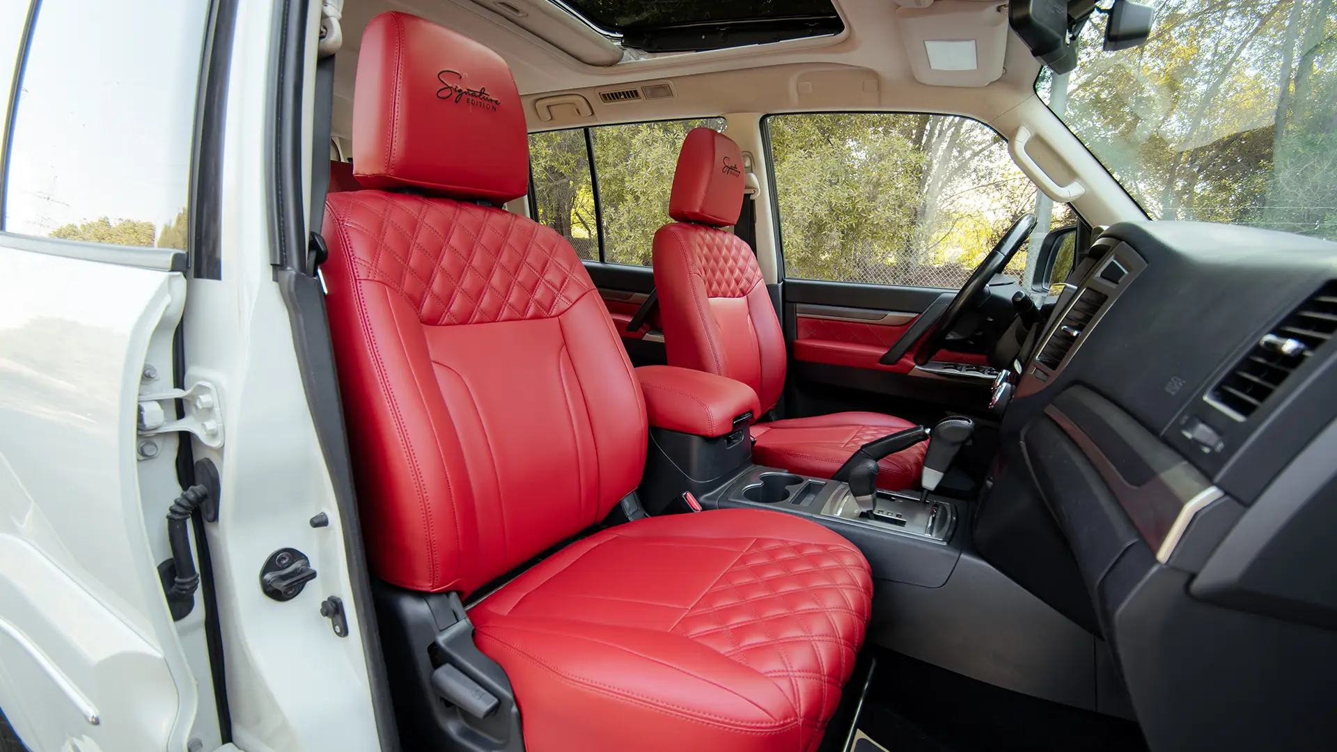 Used 2022 Mitsubishi Pajero GLS in White – Front Passenger Side Cabin View for Sale at First Choice Cars Dubai Sharjah