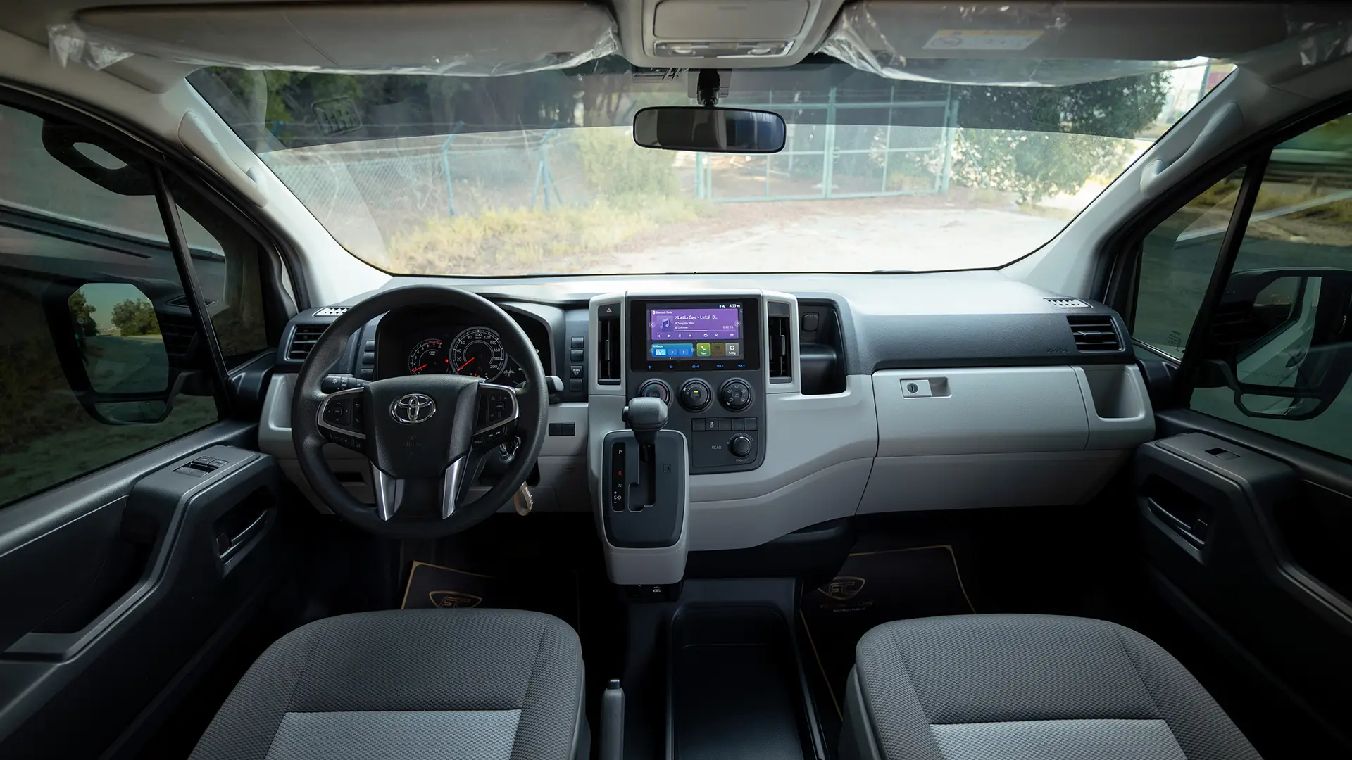 Used 2025 Toyota Hiace GLX High Roof in White – Front Cabin / Dashboard Full View for Sale at First Choice Cars Dubai Sharjah