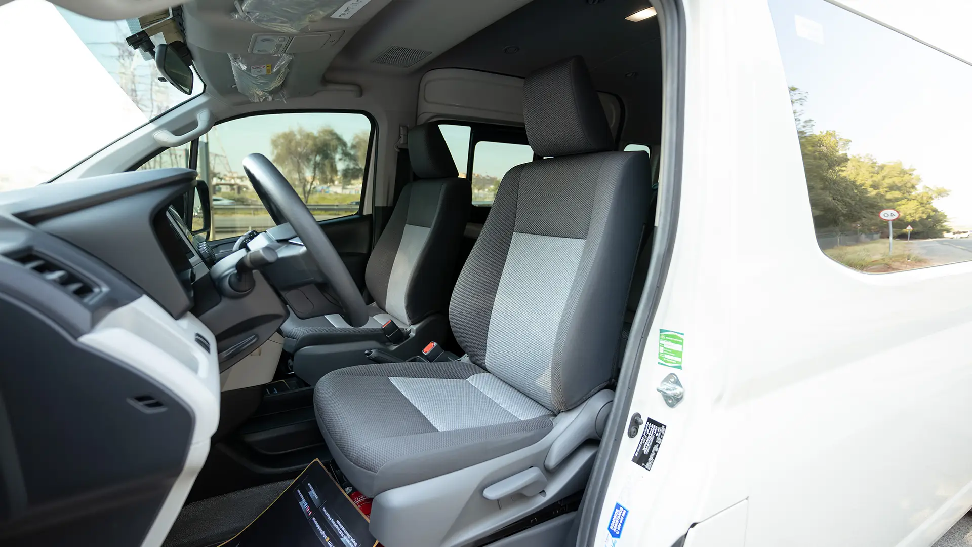 Used 2025 Toyota Hiace GLX High Roof in White – Front Driver Side Cabin View for Sale at First Choice Cars Dubai Sharjah
