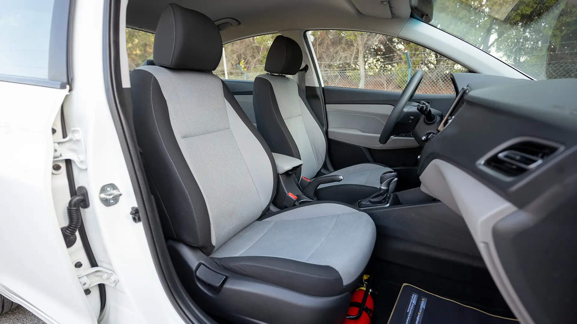 Used 2023 Hyundai Accent Smart in White – Front Passenger Side Cabin View for Sale at First Choice Cars Dubai Sharjah