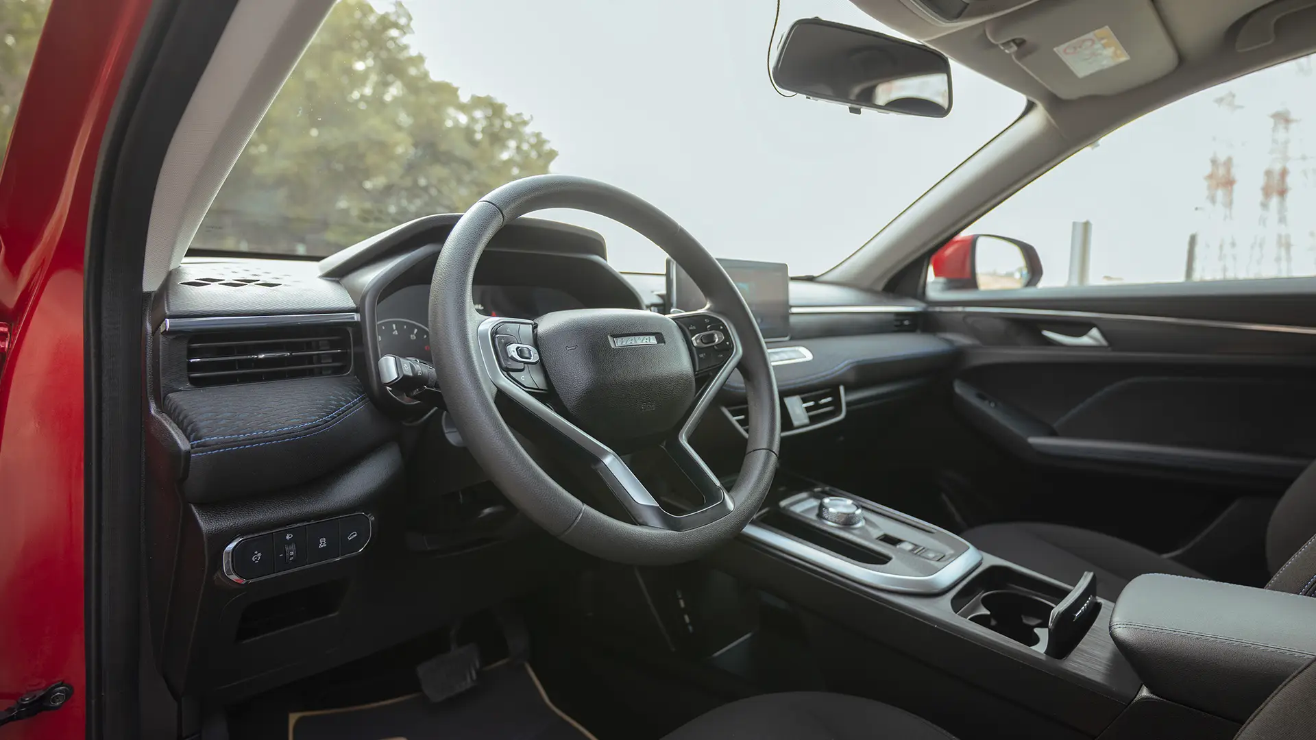 Used 2023 Haval Jolion Plus in Red – Driver Side Dashboard & Steering View for Sale at First Choice Cars Dubai Sharjah