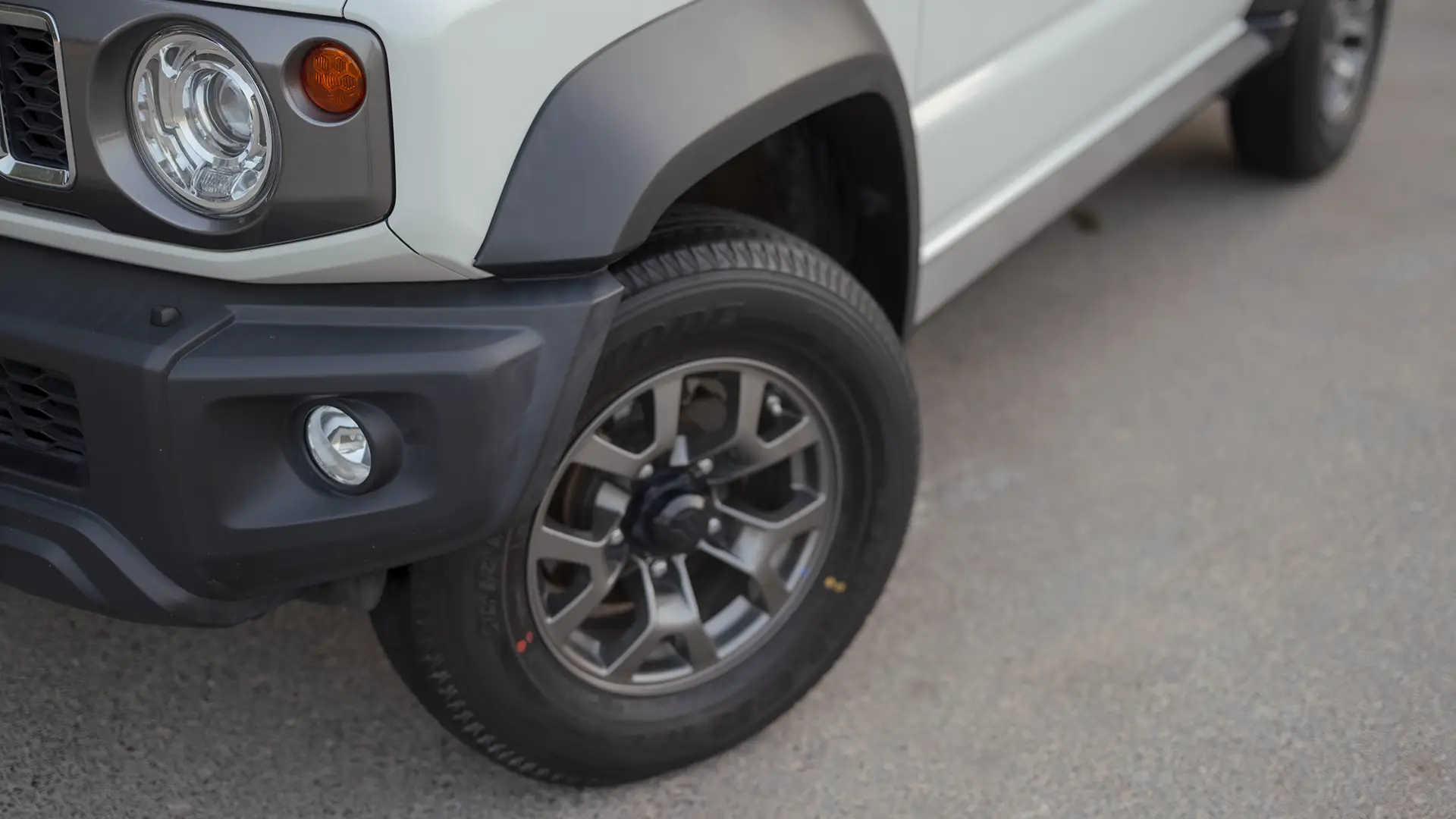 Used 2024 Suzuki Jimny GLX in White – Headlight Close-up for Sale at First Choice Cars Dubai Sharjah