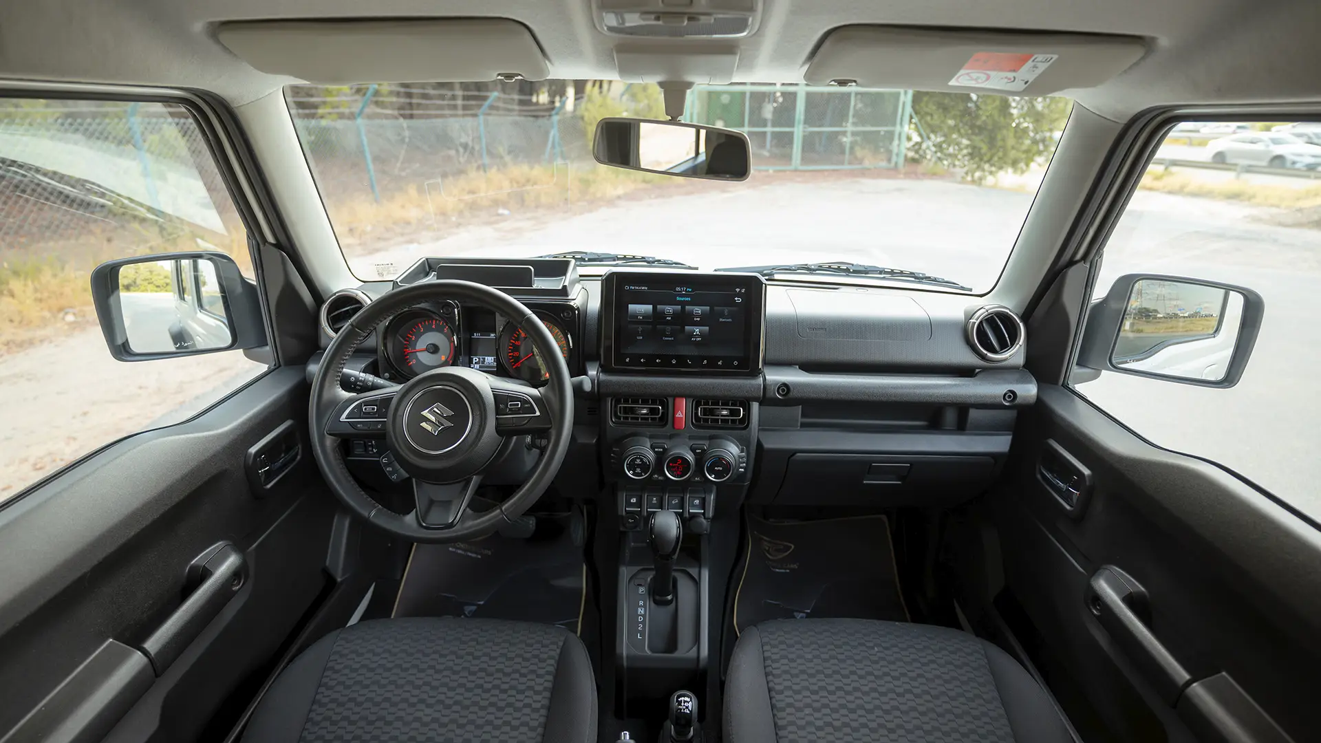 Used 2024 Suzuki Jimny GLX in White – Front Cabin / Dashboard Full View for Sale at First Choice Cars Dubai Sharjah