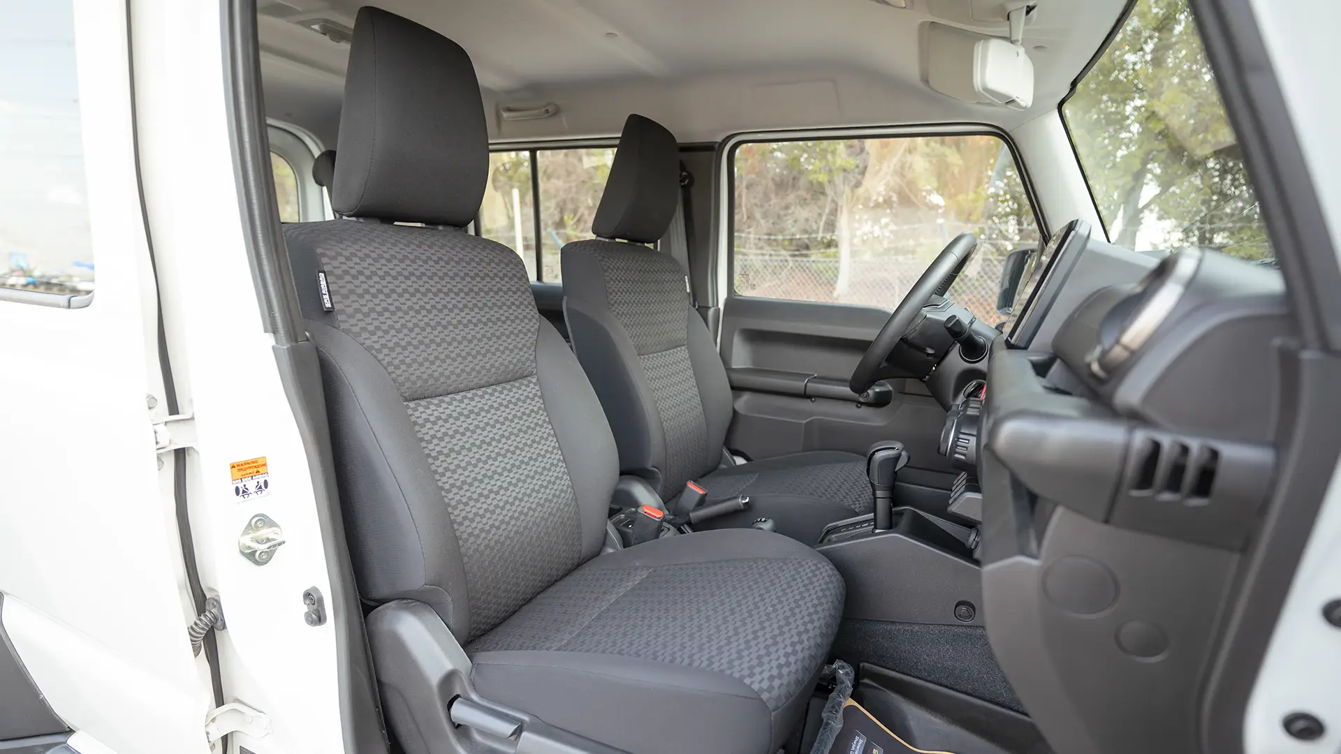 Used 2024 Suzuki Jimny GLX in White – Front Passenger Side Cabin View for Sale at First Choice Cars Dubai Sharjah