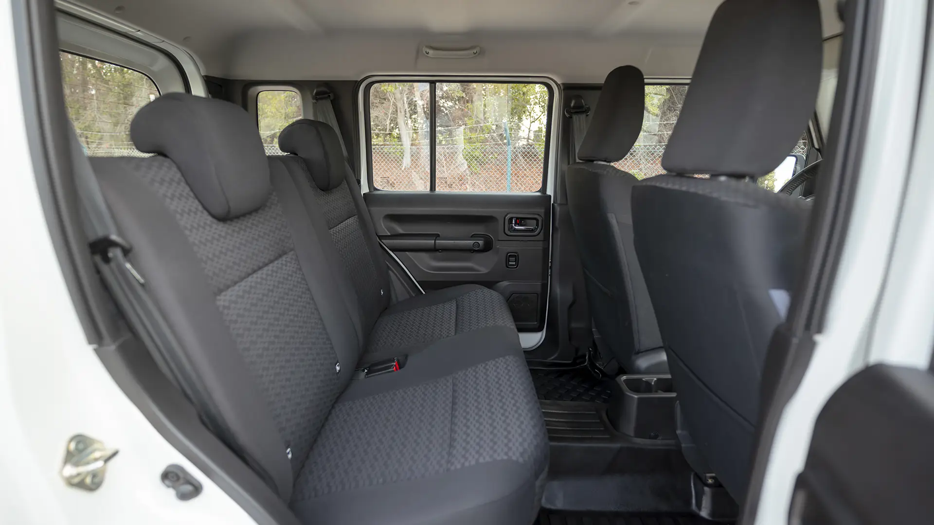 Used 2024 Suzuki Jimny GLX in White – Rear Passenger Side Cabin View for Sale at First Choice Cars Dubai Sharjah
