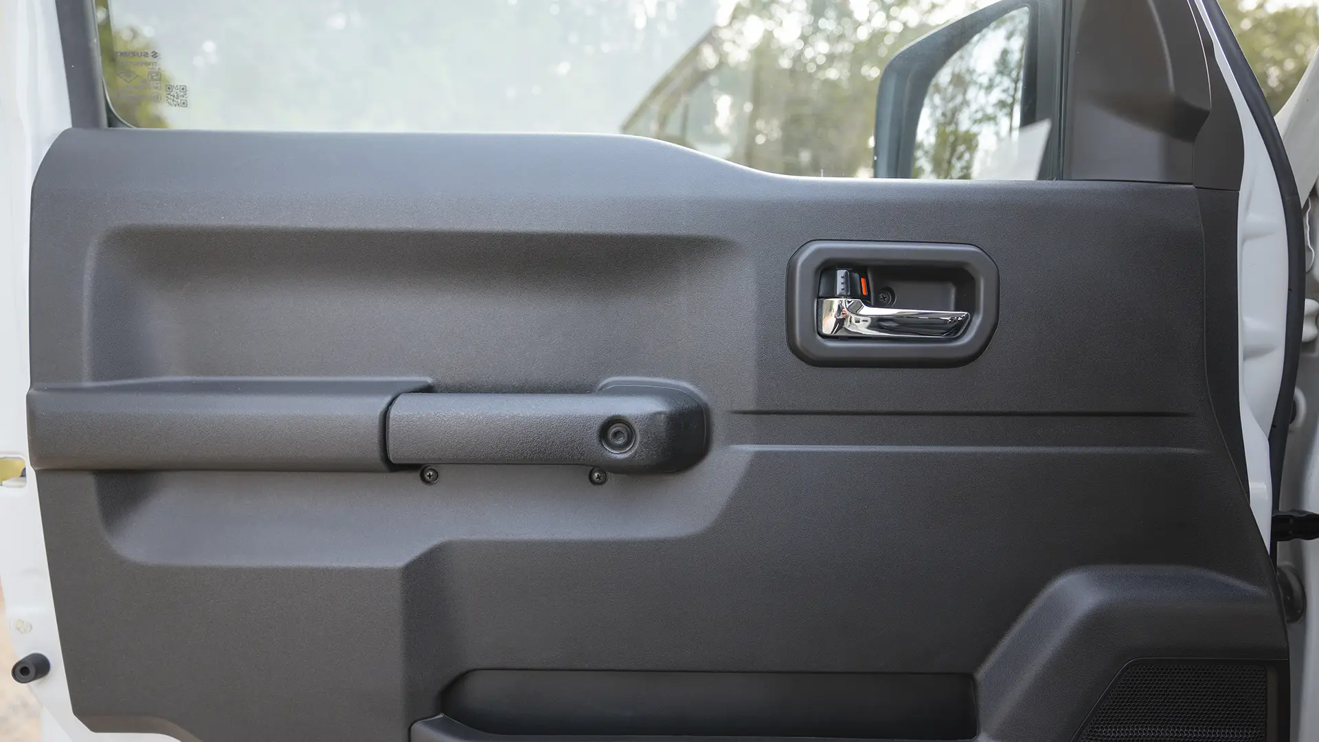 Used 2024 Suzuki Jimny GLX in White – Driver Door Panel Full View for Sale at First Choice Cars Dubai Sharjah