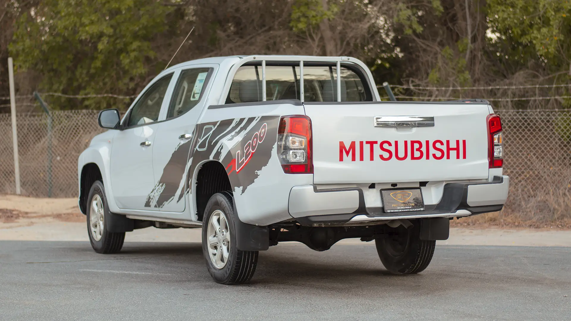 Used 2020 Mitsubishi L200 GLX Double Cabin in White – Left Back Diagonal (45°) View for Sale at First Choice Cars Dubai Sharjah