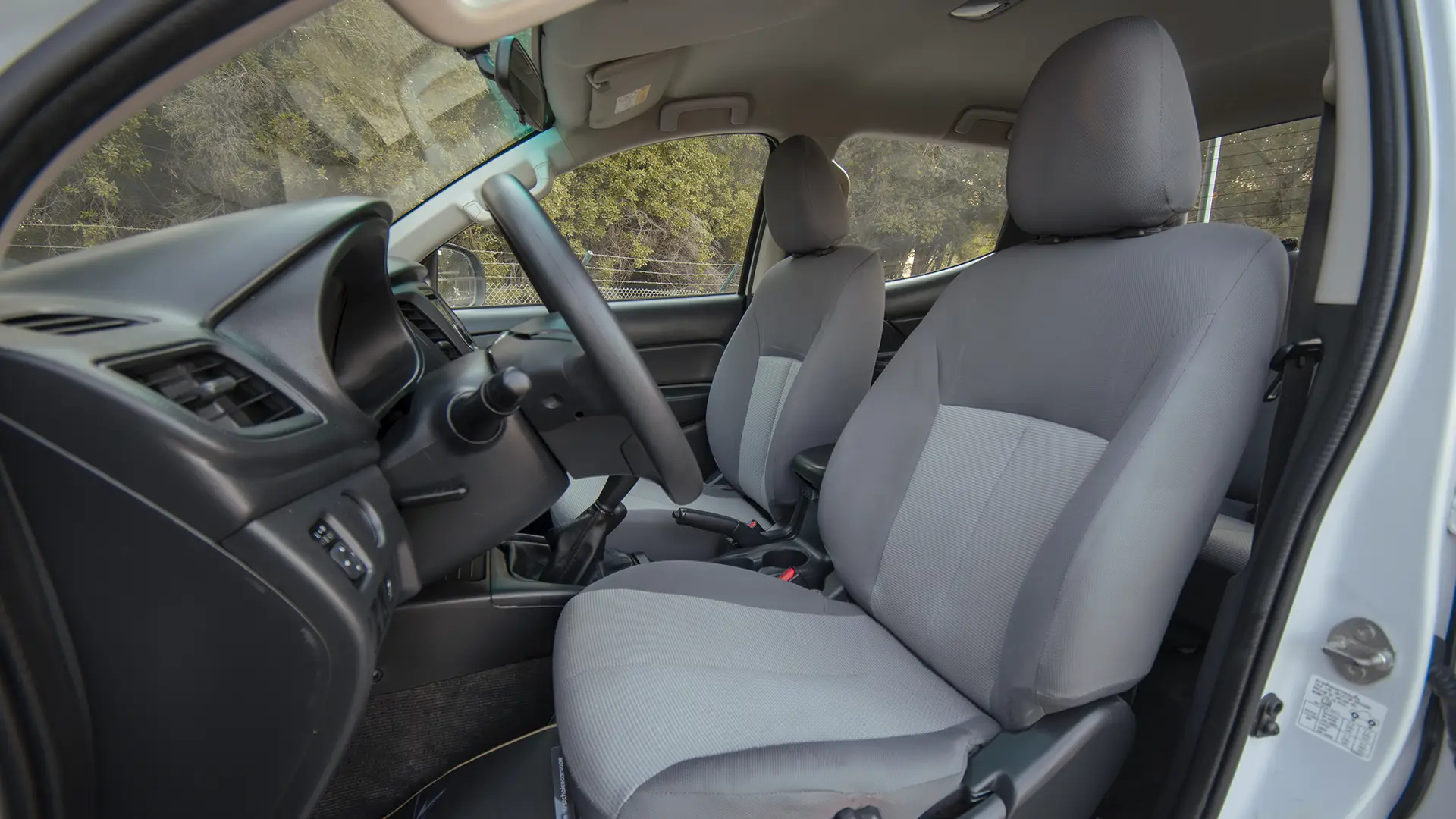 Used 2020 Mitsubishi L200 GLX Double Cabin in White – Front Driver Side Cabin View for Sale at First Choice Cars Dubai Sharjah