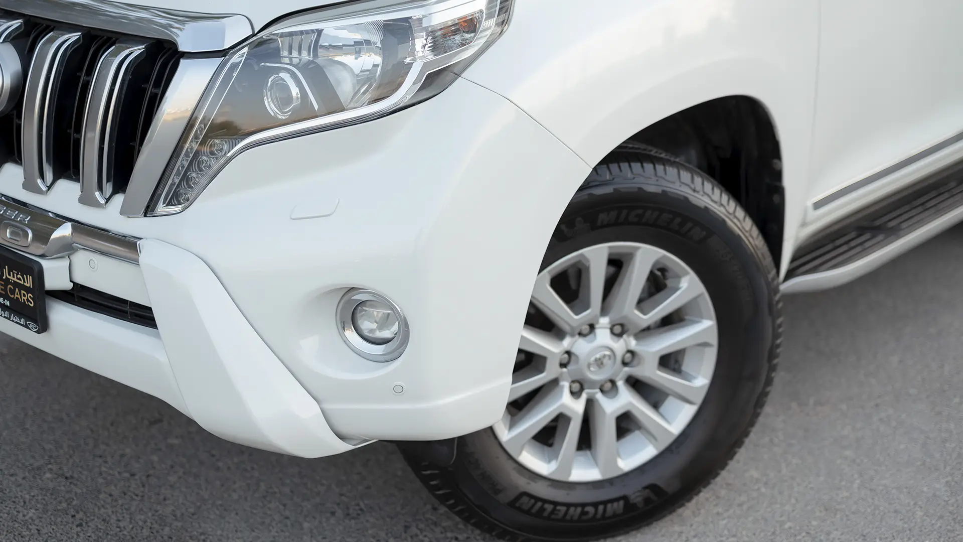 Used 2016 Toyota Prado VXR in White – Headlight Close-up for Sale at First Choice Cars Dubai Sharjah