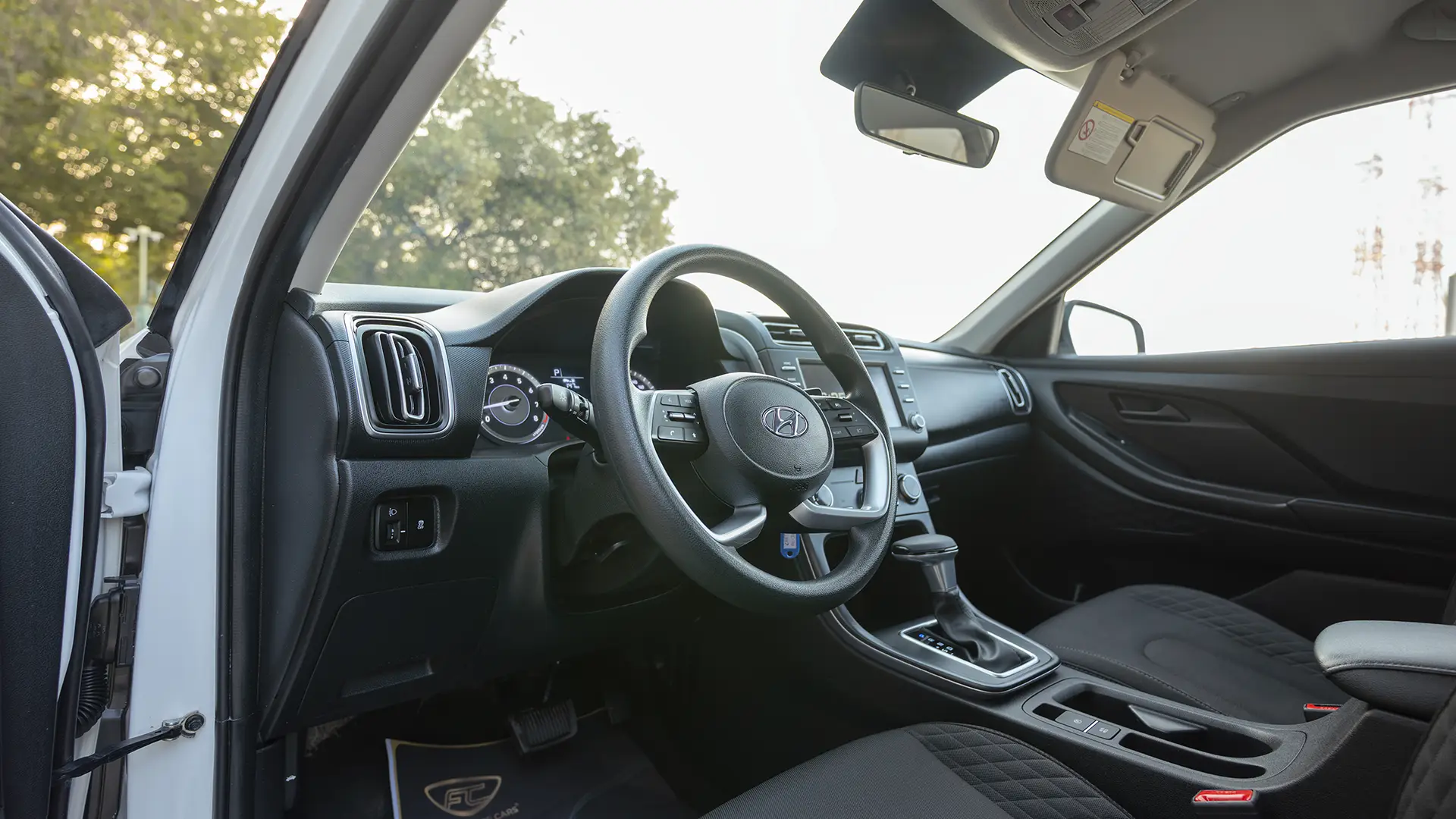 Used 2025 Hyundai Creta Smart in White – Driver Side Dashboard & Steering View for Sale at First Choice Cars Dubai Sharjah