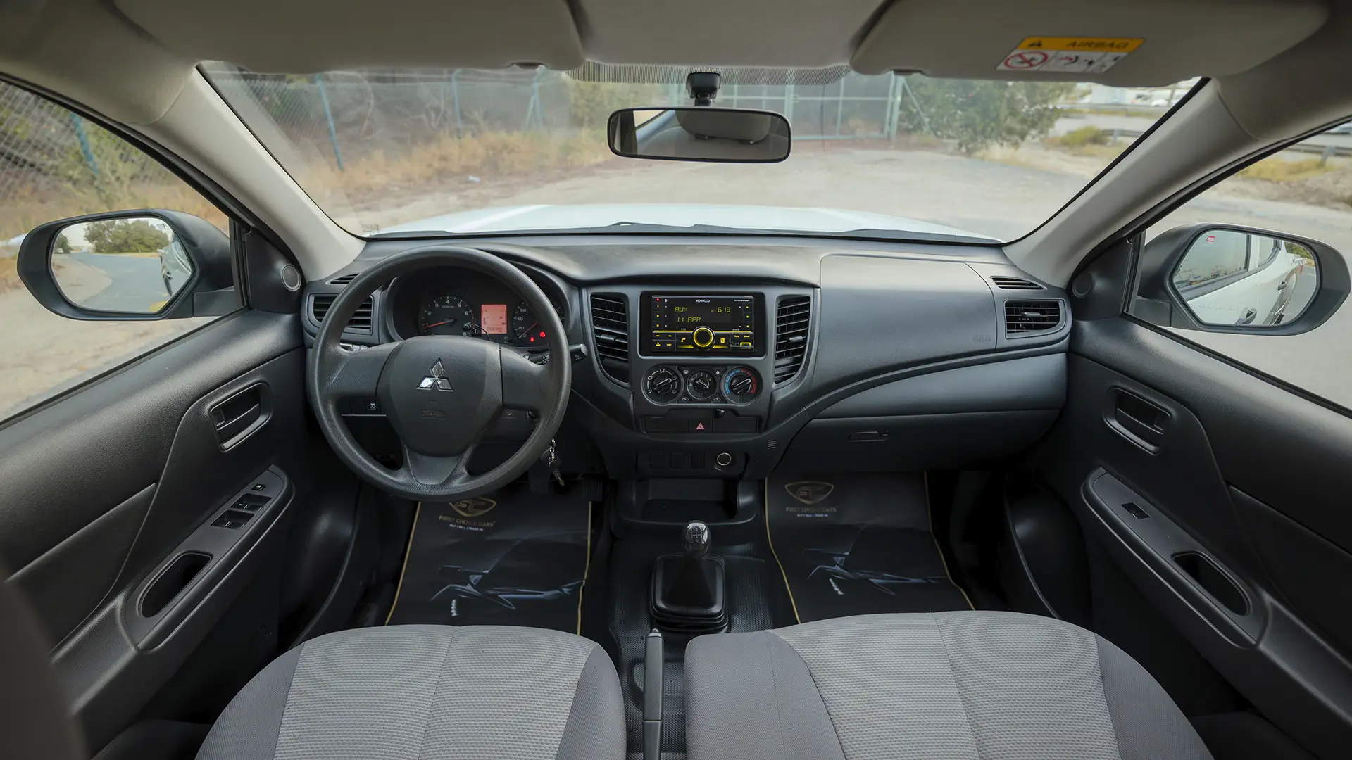 Used 2023 Mitsubishi L200 GLX Double Cabin in White – Front Cabin / Dashboard Full View for Sale at First Choice Cars Dubai Sharjah
