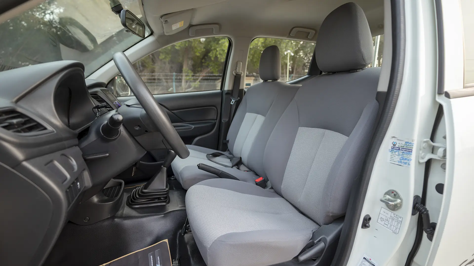 Used 2023 Mitsubishi L200 GLX Double Cabin in White – Front Driver Side Cabin View for Sale at First Choice Cars Dubai Sharjah