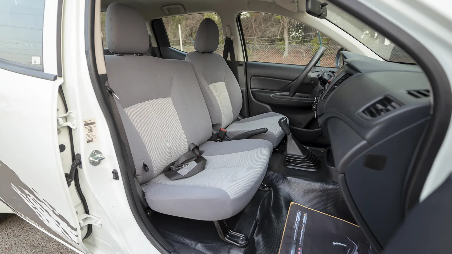 Used 2023 Mitsubishi L200 GLX Double Cabin in White – Front Passenger Side Cabin View for Sale at First Choice Cars Dubai Sharjah