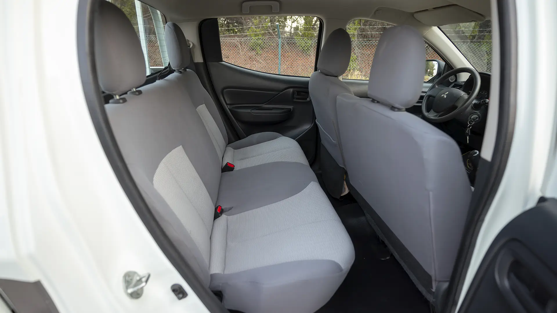 Used 2023 Mitsubishi L200 GLX Double Cabin in White – Rear Passenger Side Cabin View for Sale at First Choice Cars Dubai Sharjah