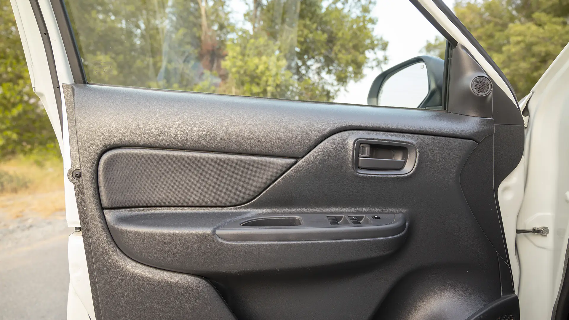 Used 2023 Mitsubishi L200 GLX Double Cabin in White – Driver Door Panel Full View for Sale at First Choice Cars Dubai Sharjah