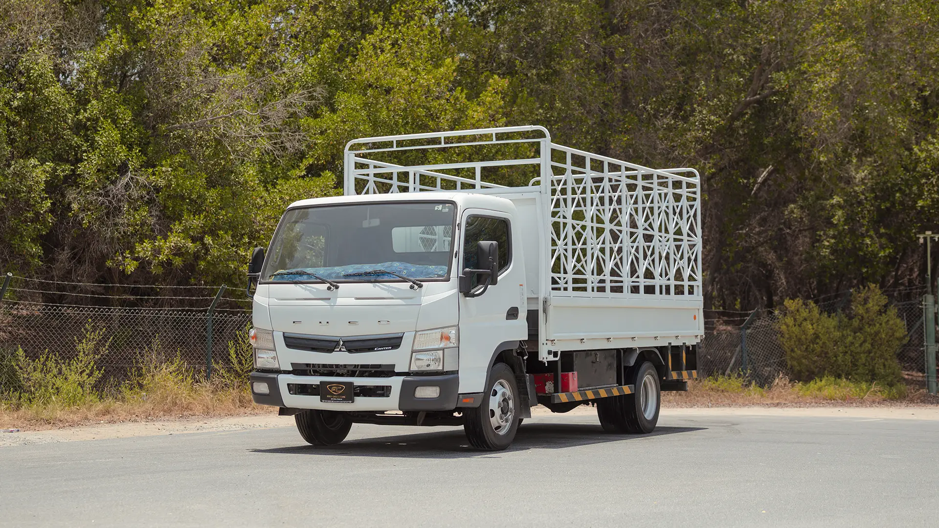 Used 2024 Mitsubishi Canter Cargo Body in White – Left Front Diagonal (45°) View for Sale at First Choice Cars Dubai Sharjah