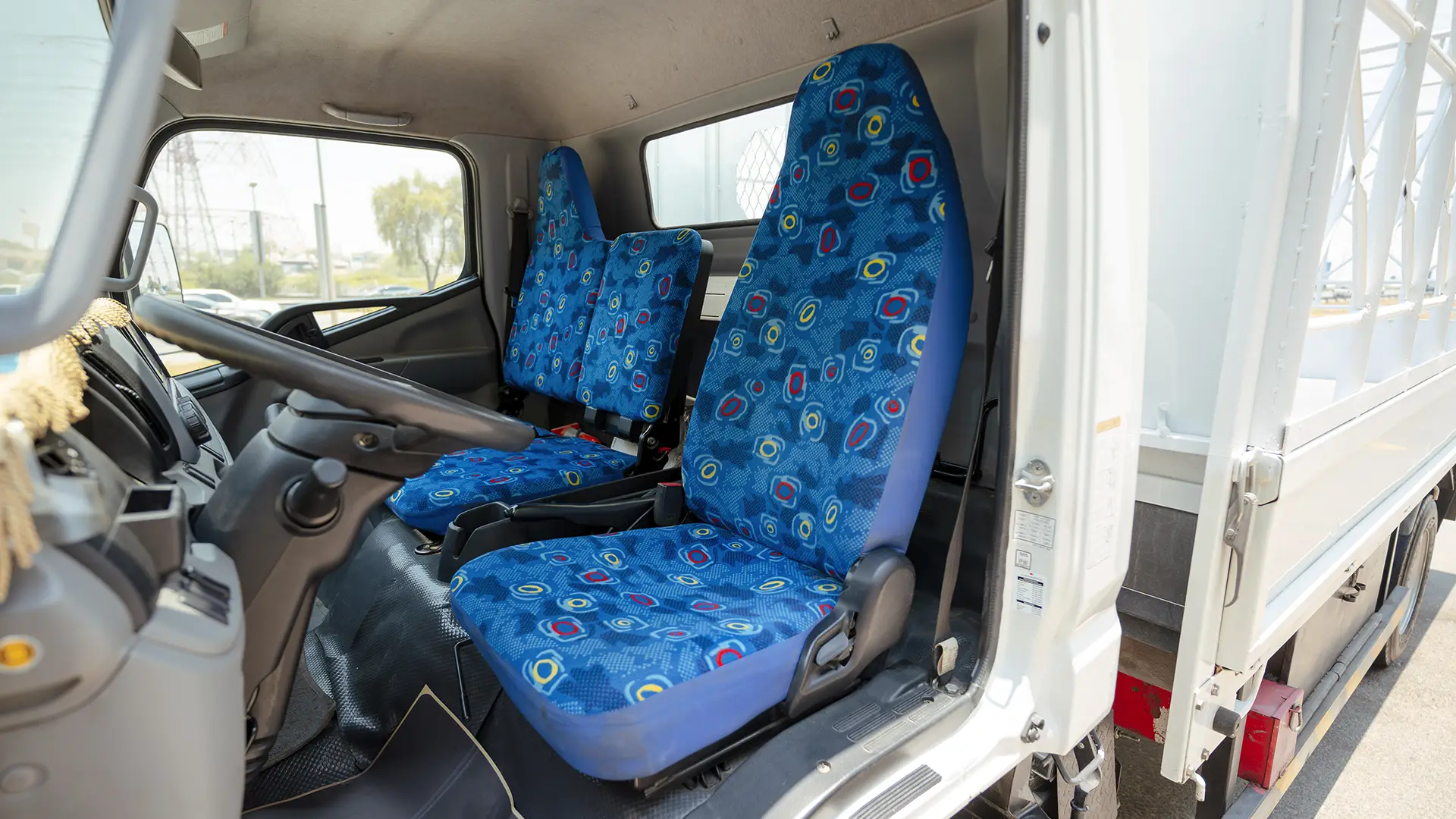 Used 2024 Mitsubishi Canter Cargo Body in White – Front Driver Side Cabin View for Sale at First Choice Cars Dubai Sharjah