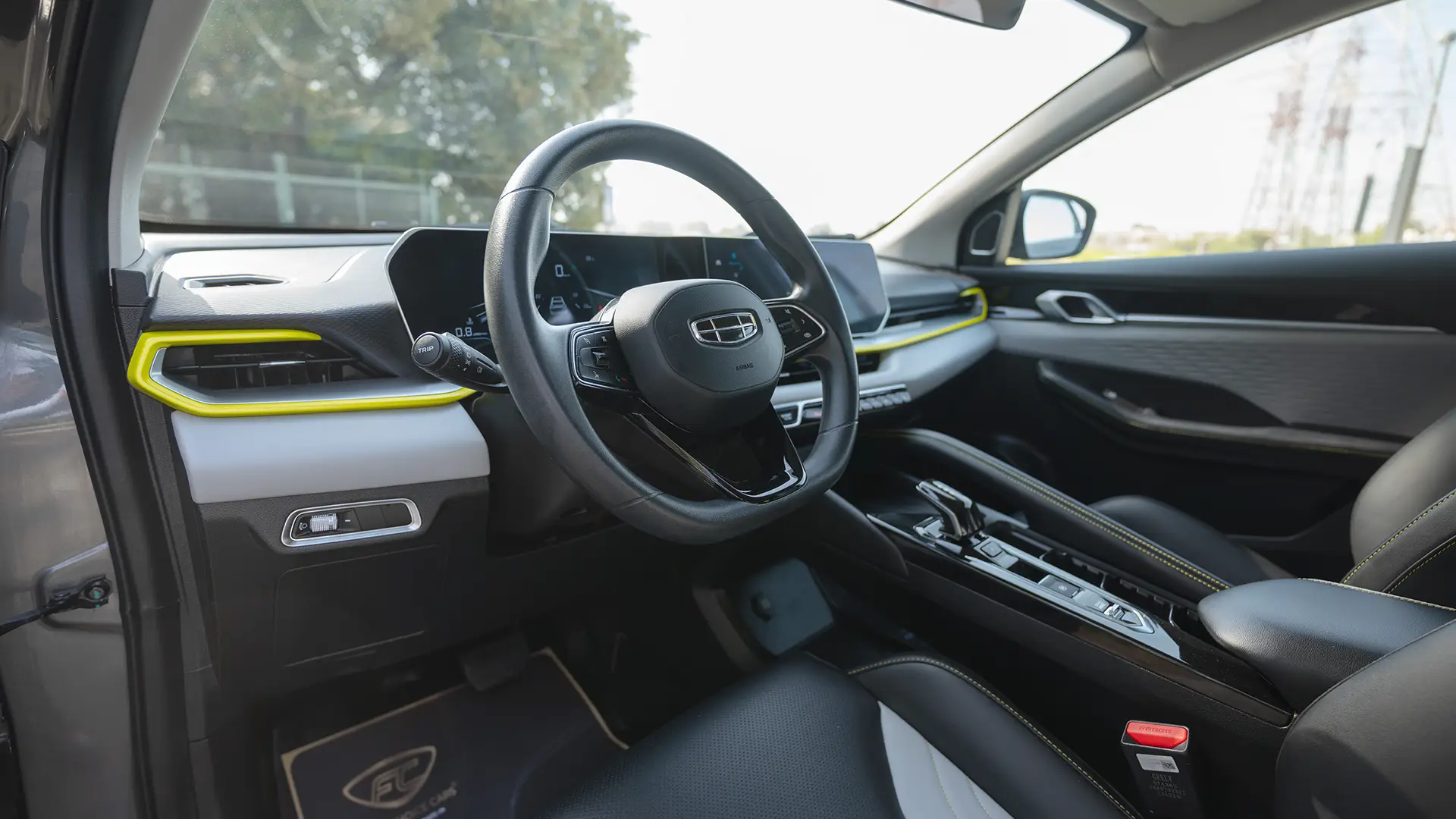 Used 2025 Geely Coolray GL in Grey – Driver Side Dashboard & Steering View for Sale at First Choice Cars Dubai Sharjah