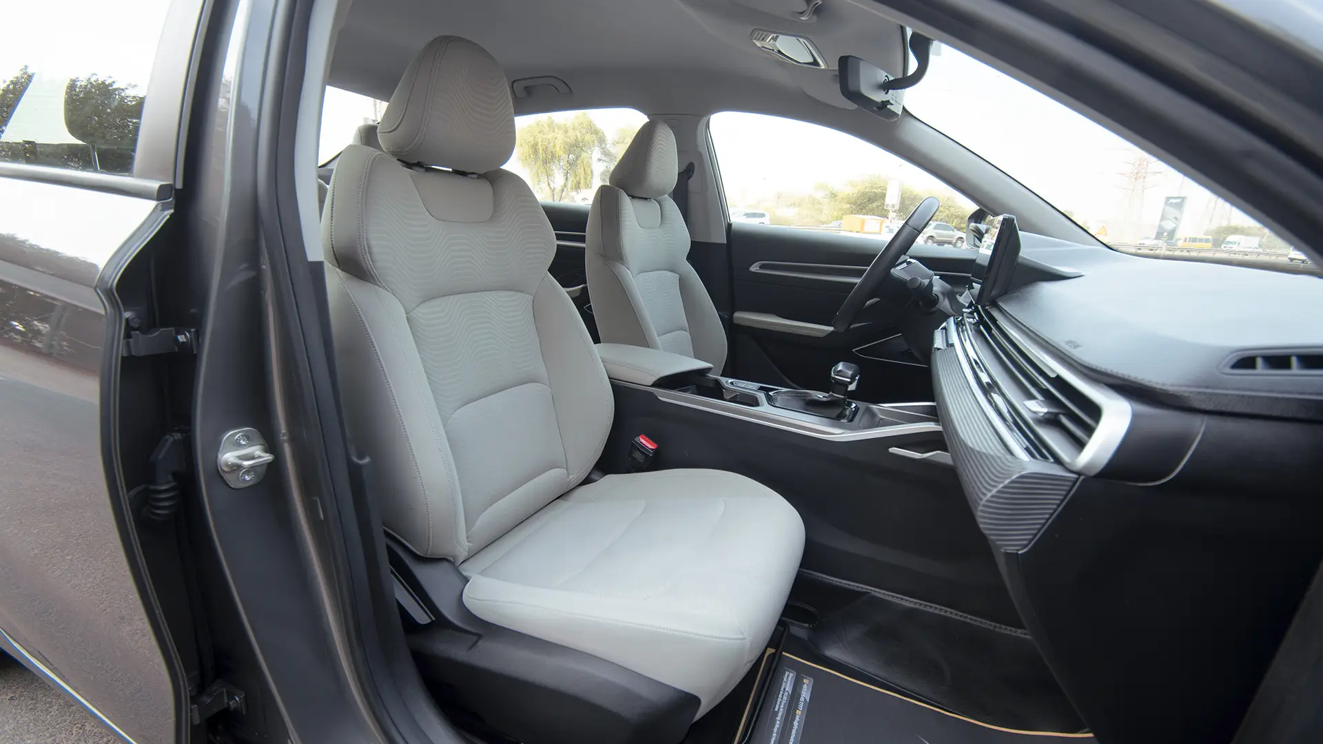 Used 2024 Geely Emgrand GS in Grey – Front Passenger Side Cabin View for Sale at First Choice Cars Dubai Sharjah