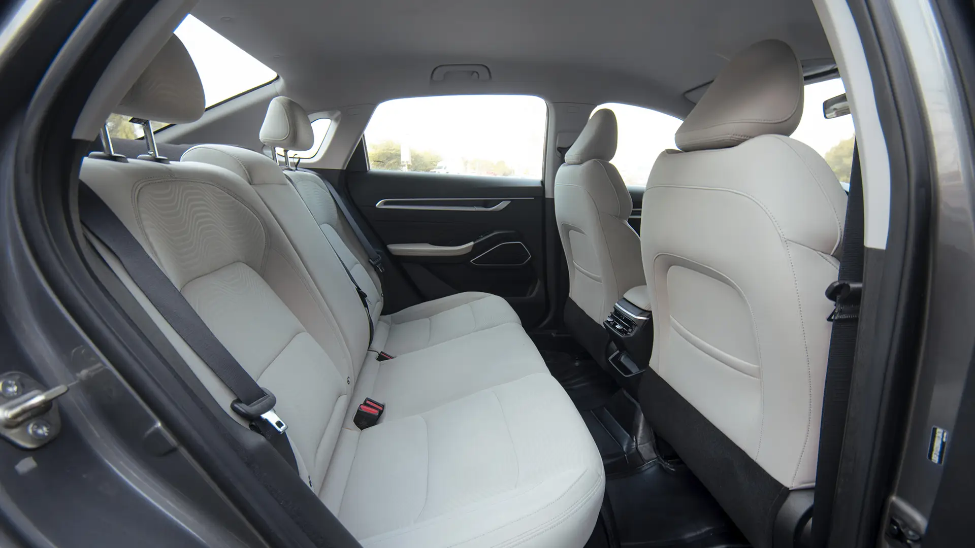 Used 2024 Geely Emgrand GS in Grey – Rear Passenger Side Cabin View for Sale at First Choice Cars Dubai Sharjah