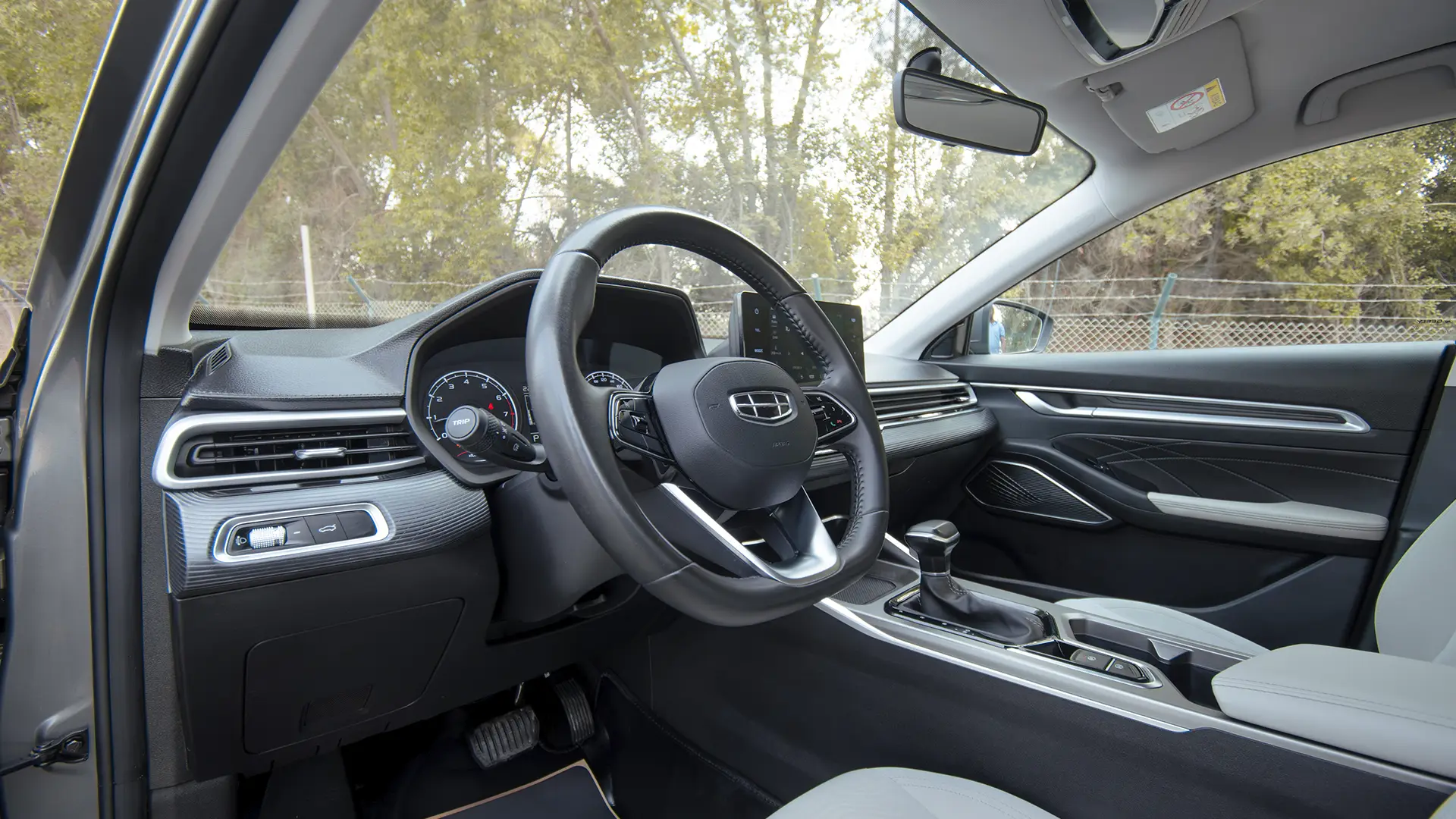 Used 2024 Geely Emgrand GS in Grey – Driver Side Dashboard & Steering View for Sale at First Choice Cars Dubai Sharjah