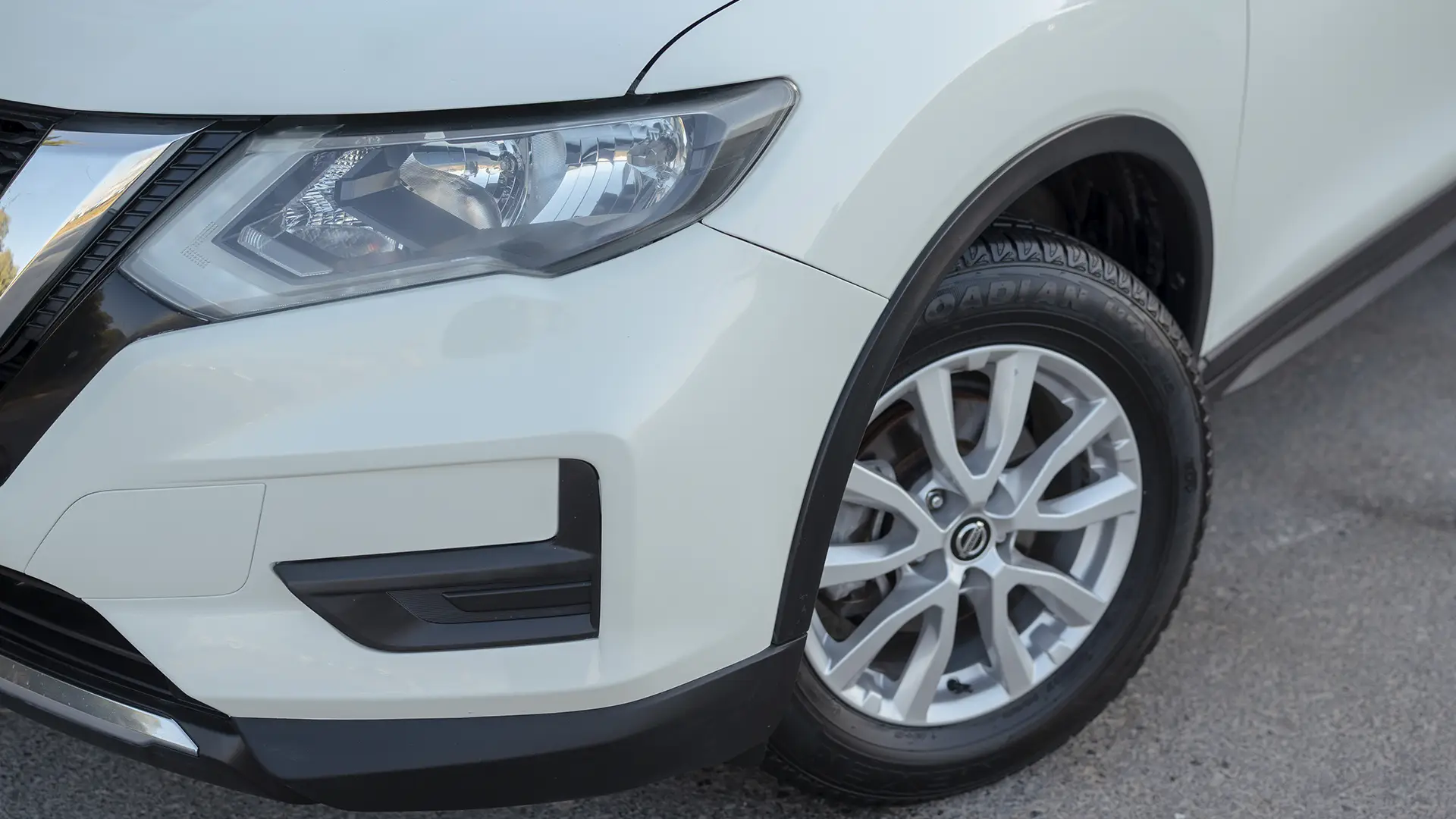 Used 2022 Nissan X-Trail S in White – Headlight Close-up for Sale at First Choice Cars Dubai Sharjah