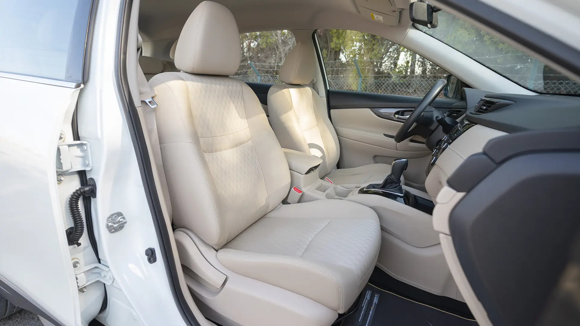 Used 2022 Nissan X-Trail S in White – Front Passenger Side Cabin View for Sale at First Choice Cars Dubai Sharjah