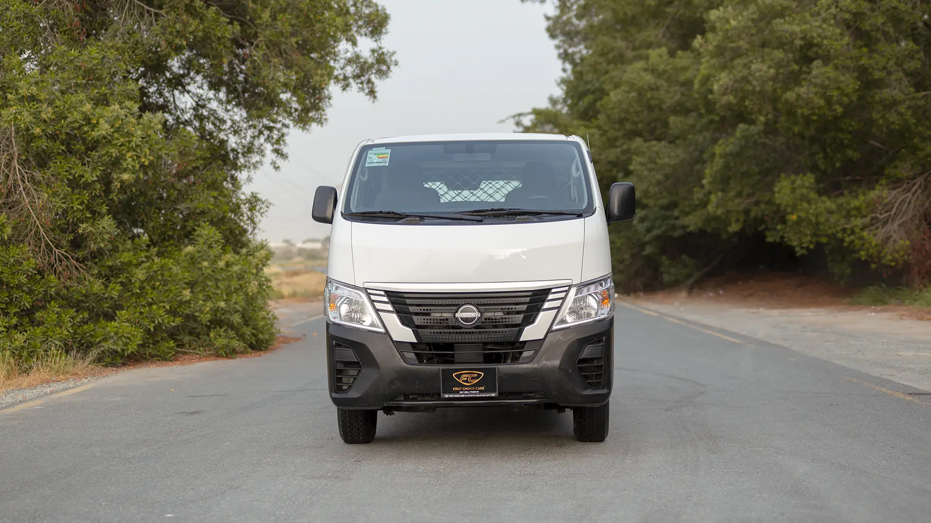Used 2023 Nissan Urvan Standard Roof in White – Front View for Sale at First Choice Cars Dubai Sharjah