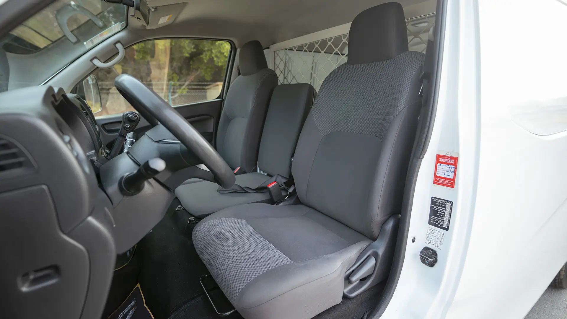 Used 2023 Nissan Urvan Standard Roof in White – Front Driver Side Cabin View for Sale at First Choice Cars Dubai Sharjah