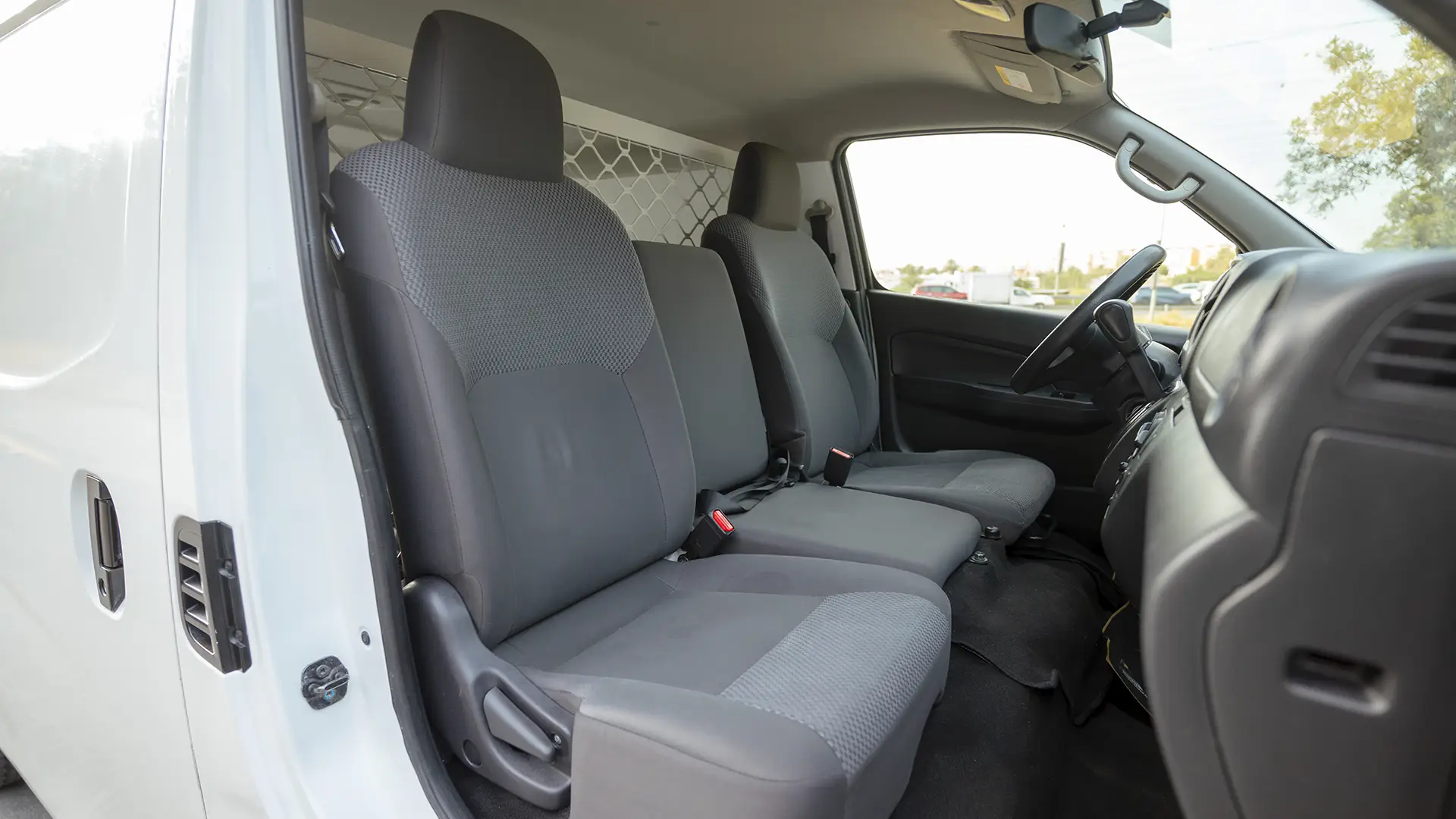Used 2023 Nissan Urvan Standard Roof in White – Front Passenger Side Cabin View for Sale at First Choice Cars Dubai Sharjah