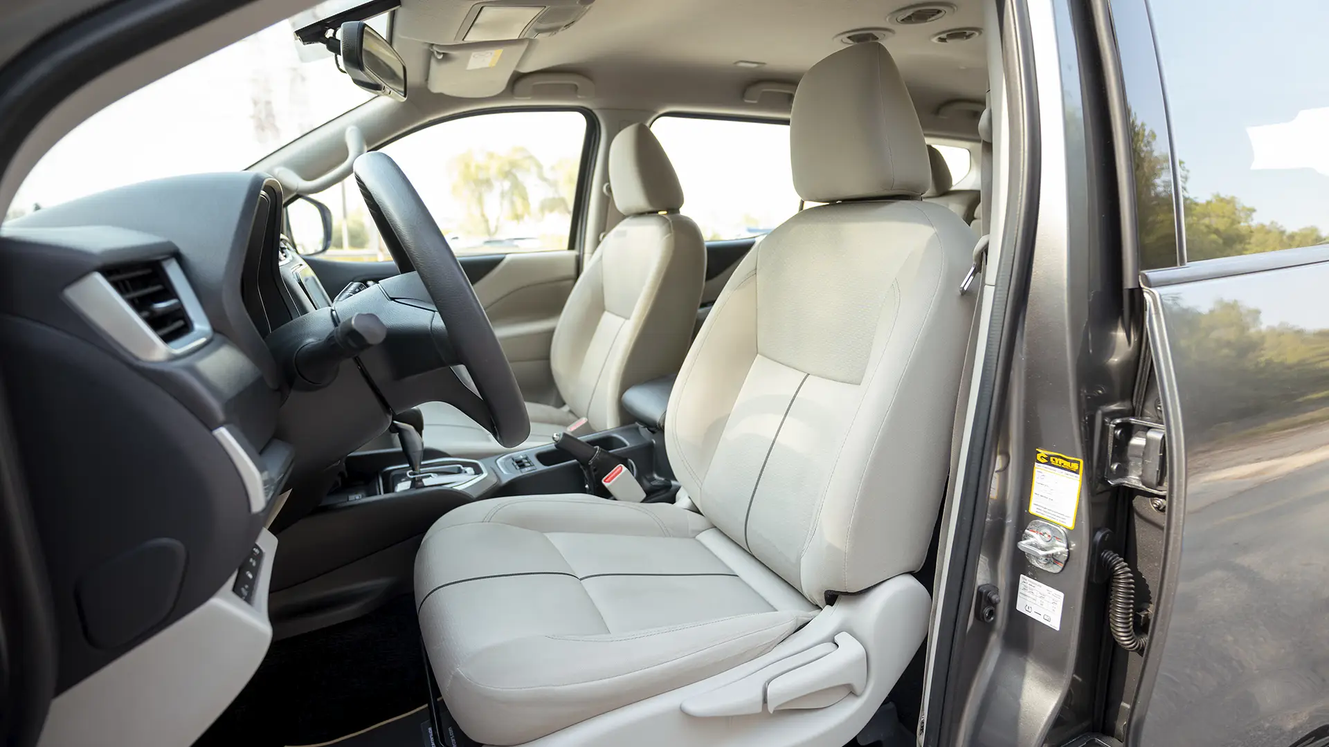 Used 2023 Nissan Xterra Titanium in White – Front Driver Side Cabin View for Sale at First Choice Cars Dubai Sharjah