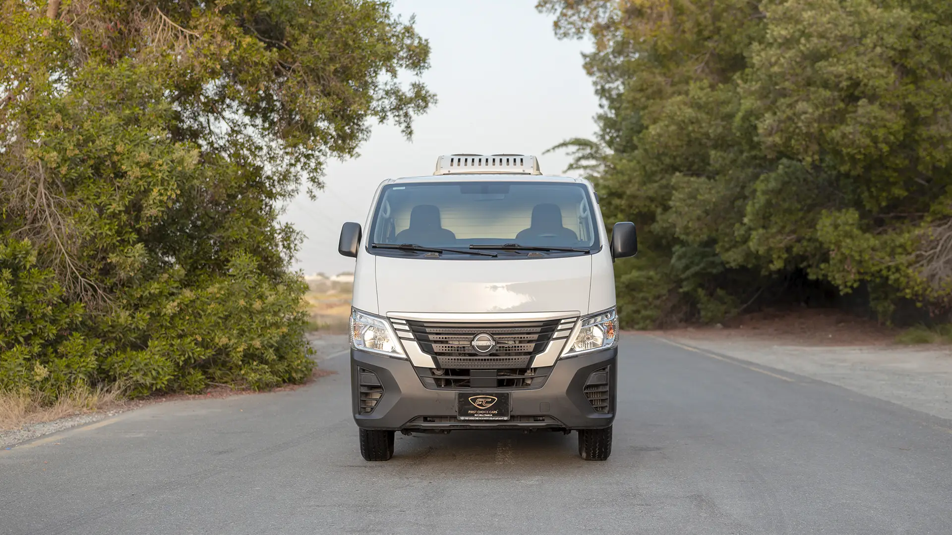 Used 2023 Nissan Urvan Standard Roof in White – Front View for Sale at First Choice Cars Dubai Sharjah