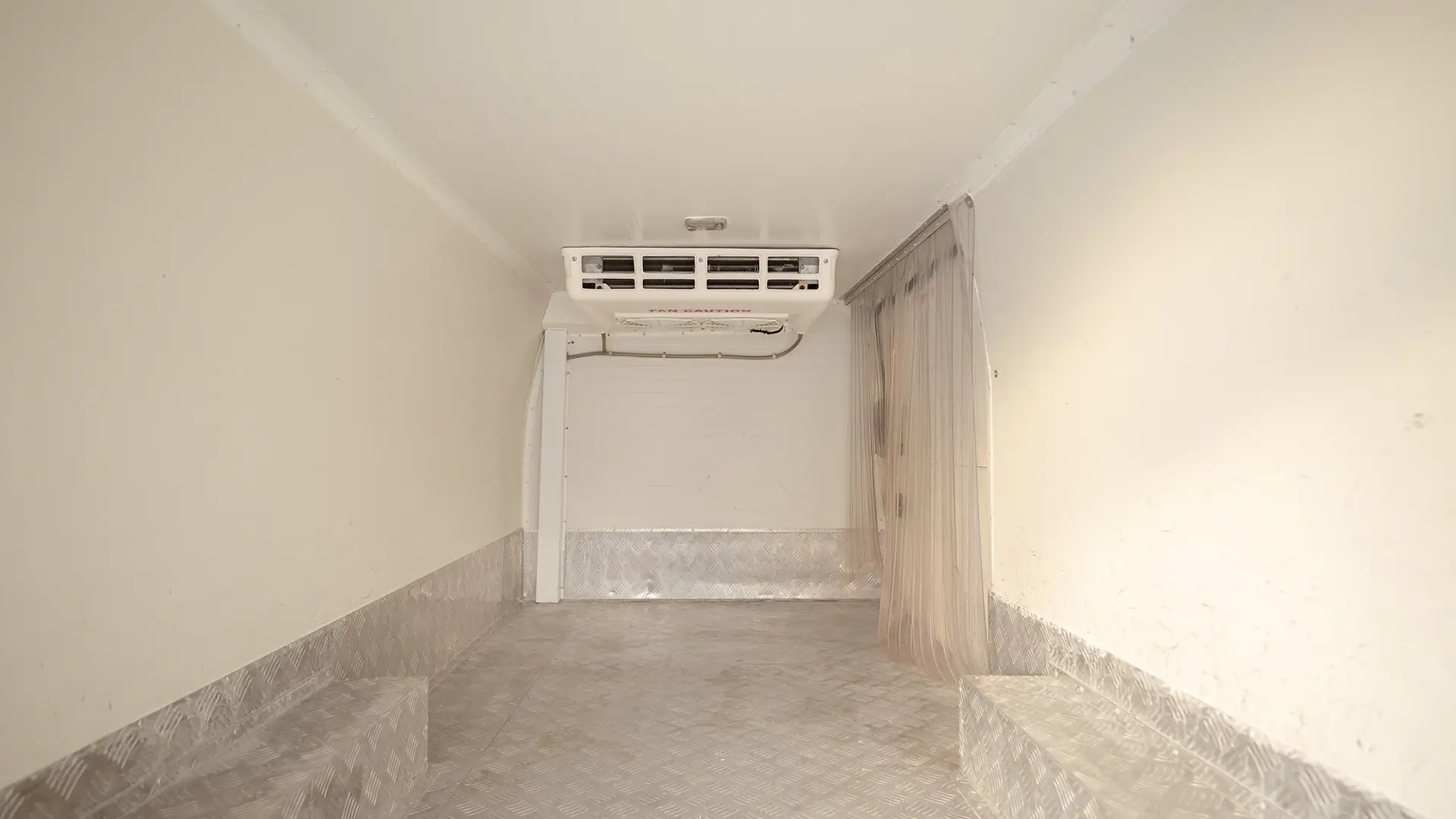 Used 2023 Nissan Urvan Standard Roof in White – Chiller Box Rear Opening View for Sale at First Choice Cars Dubai Sharjah