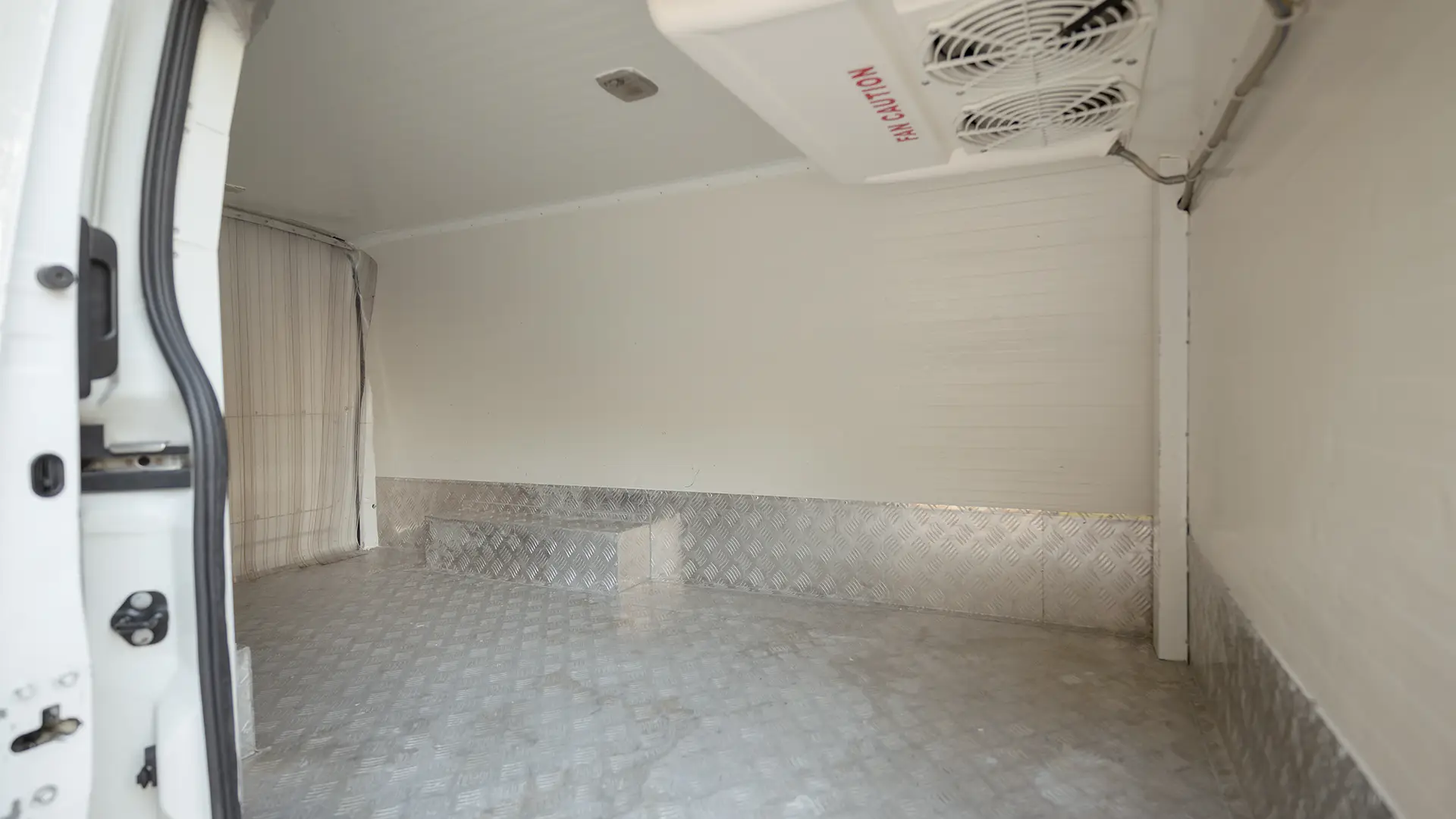 Used 2023 Nissan Urvan Standard Roof in White – Chiller Box Right Side Interior View for Sale at First Choice Cars Dubai Sharjah