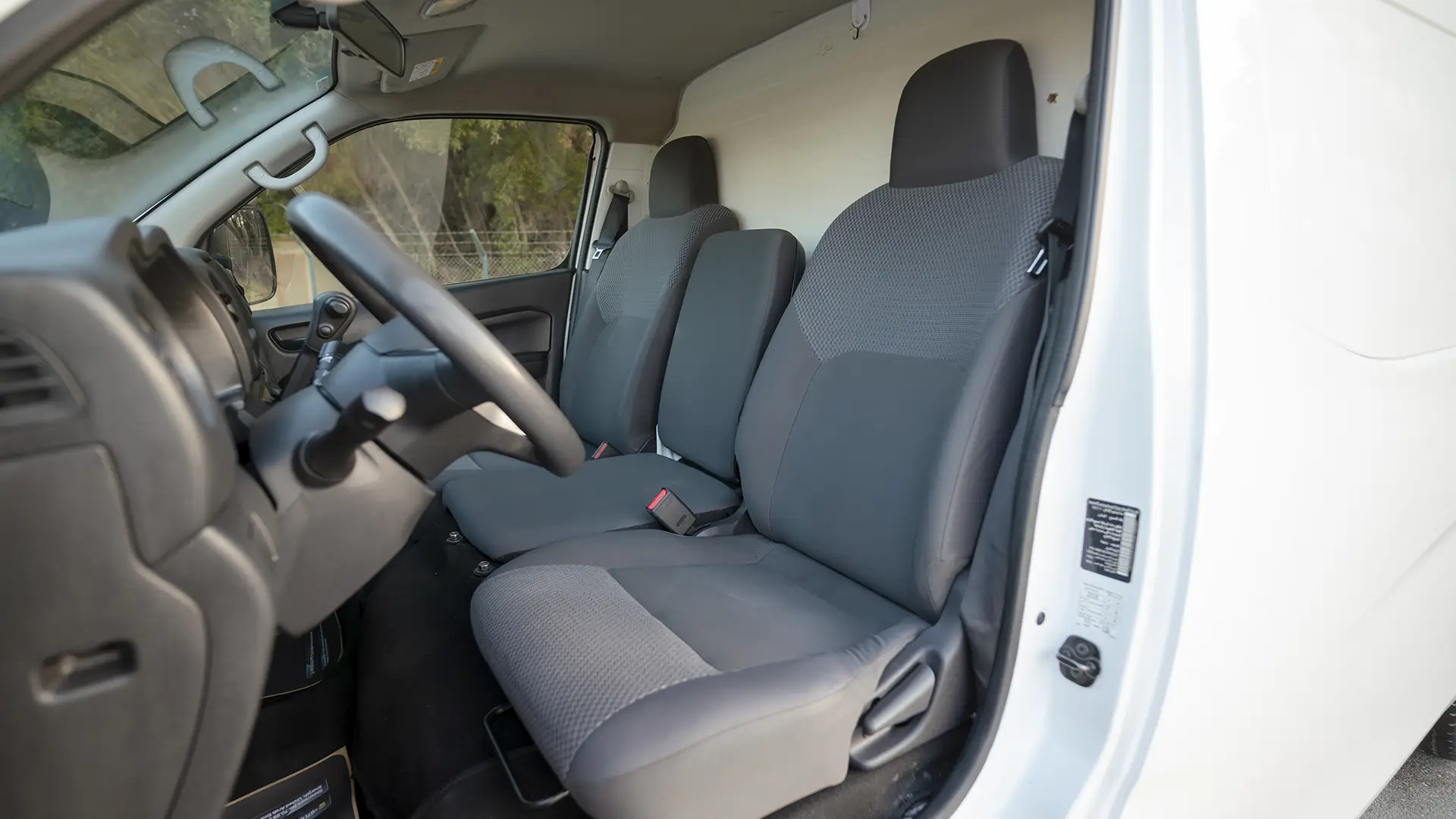 Used 2023 Nissan Urvan Standard Roof in White – Front Driver Side Cabin View for Sale at First Choice Cars Dubai Sharjah