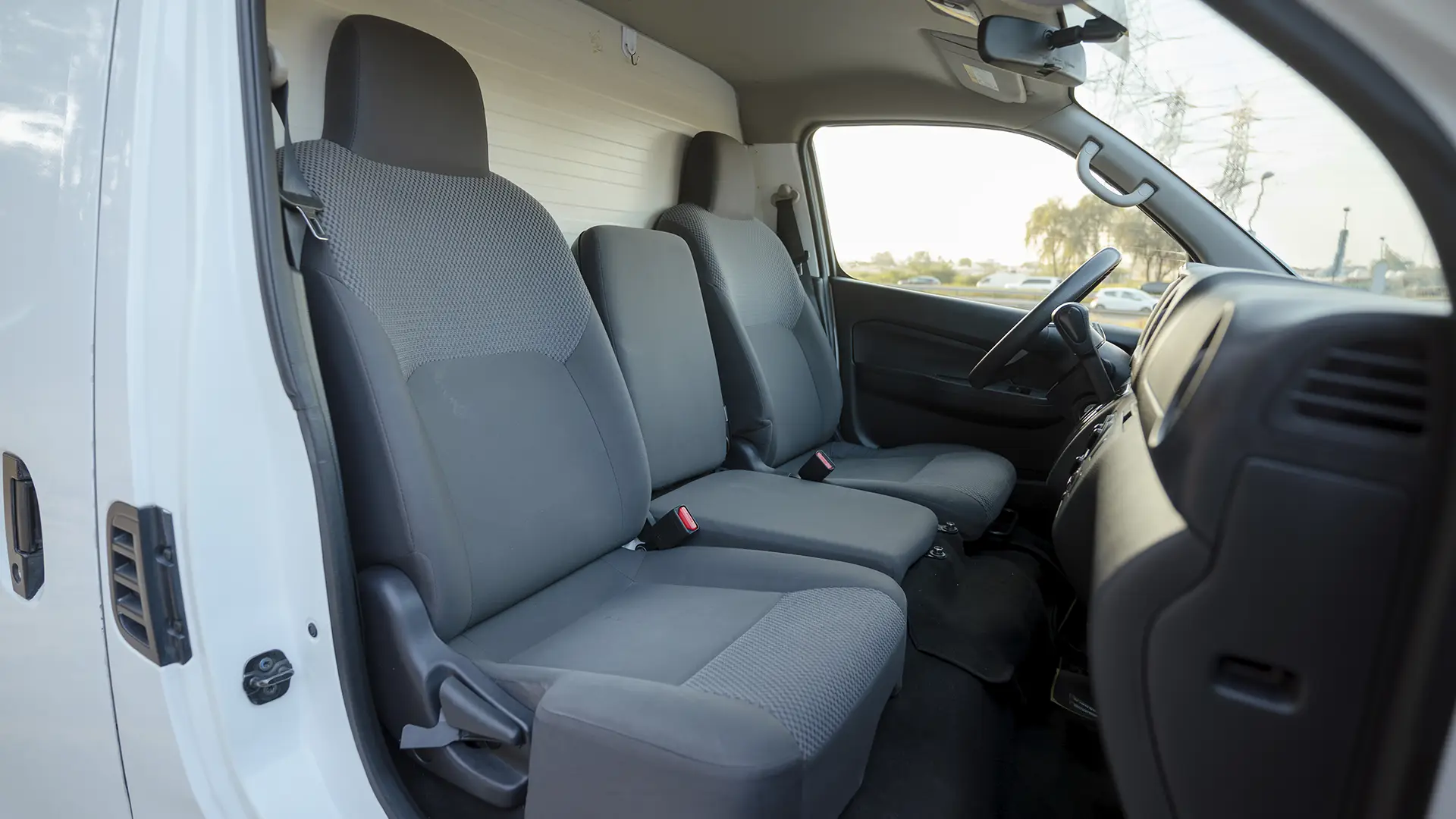 Used 2023 Nissan Urvan Standard Roof in White – Front Passenger Side Cabin View for Sale at First Choice Cars Dubai Sharjah