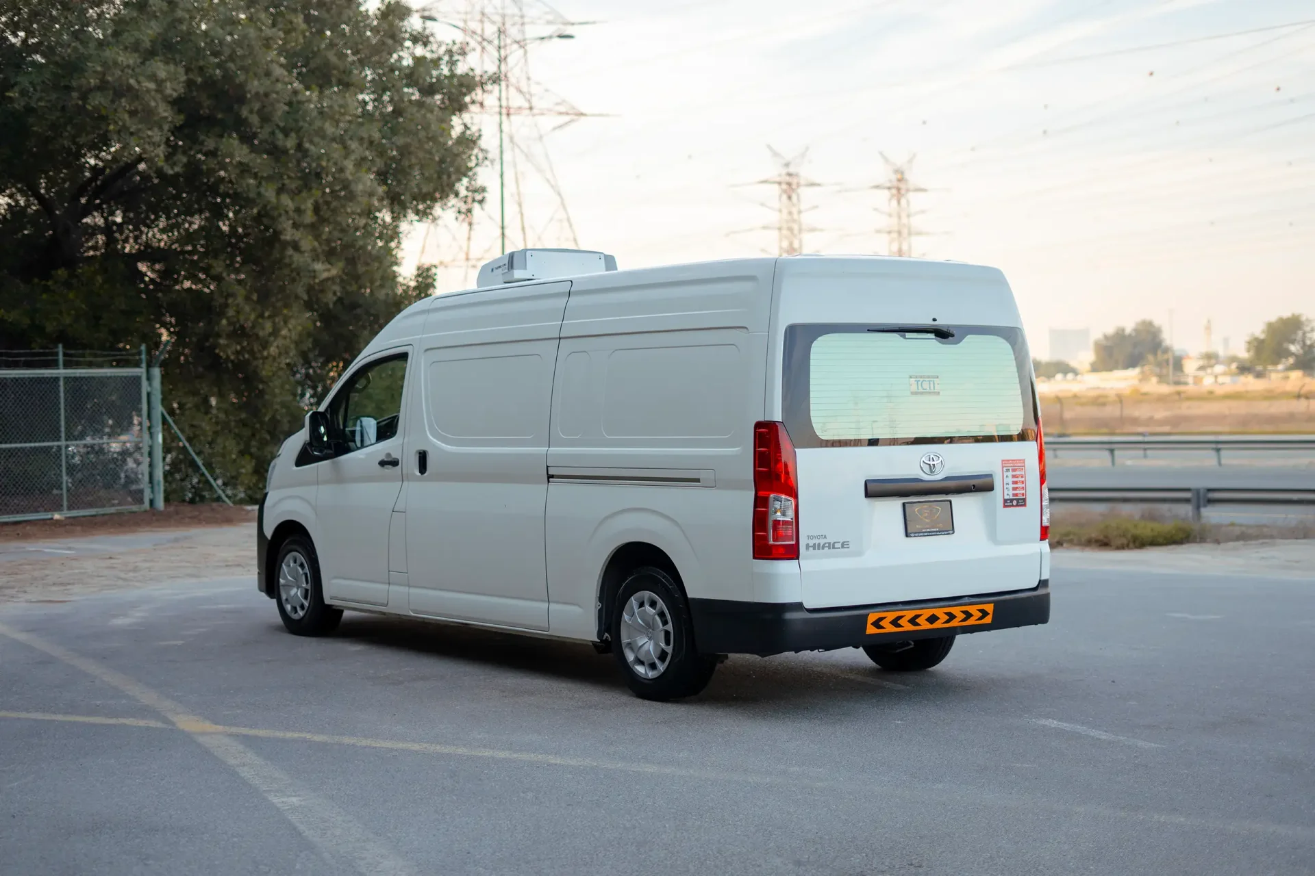 Used 2020 Toyota Hiace GLX High Roof in White – Left Back Diagonal (45°) View for Sale at First Choice Cars Dubai Sharjah