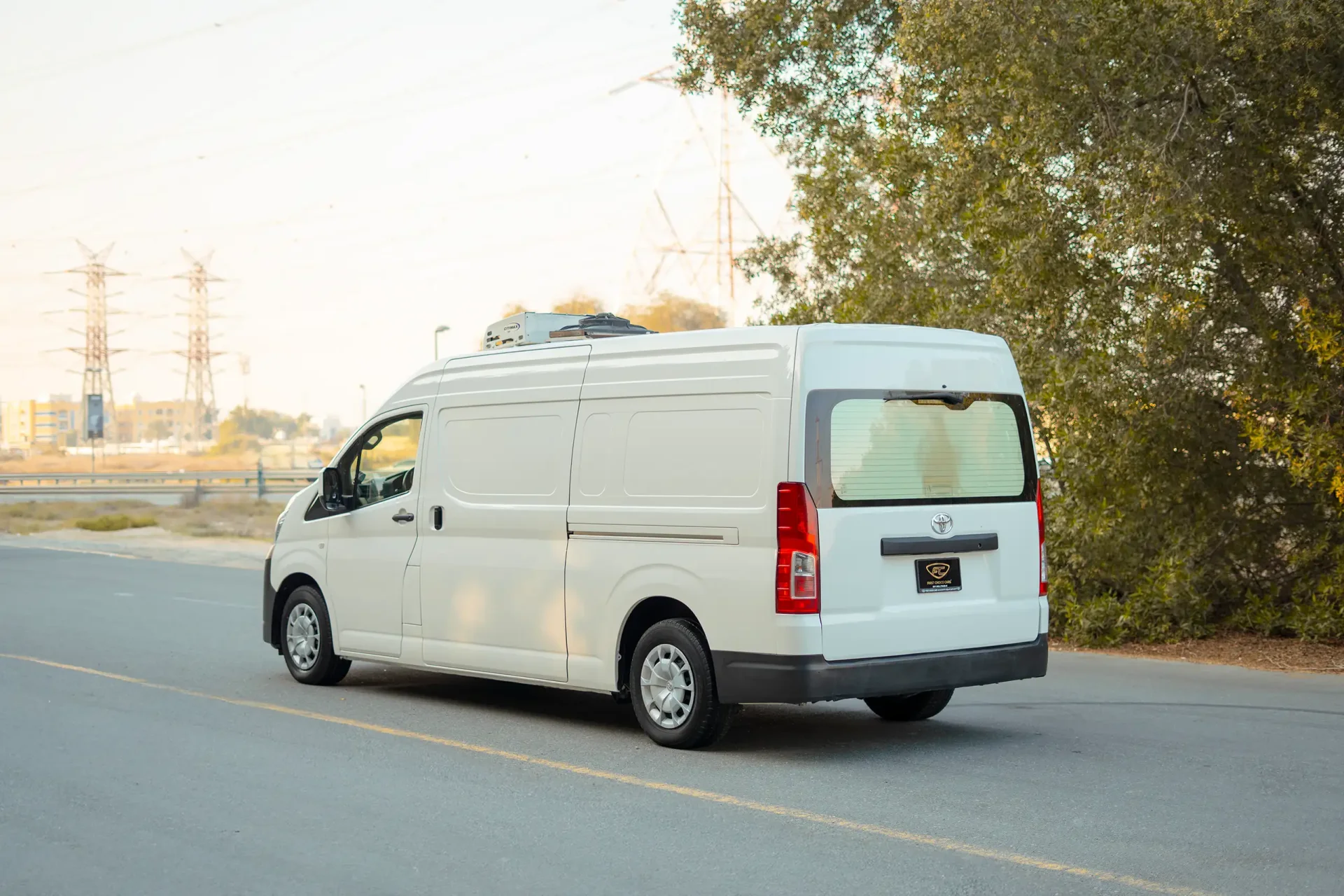 Used 2020 Toyota Hiace GLX High Roof in White – Left Back Diagonal (45°) View for Sale at First Choice Cars Dubai Sharjah
