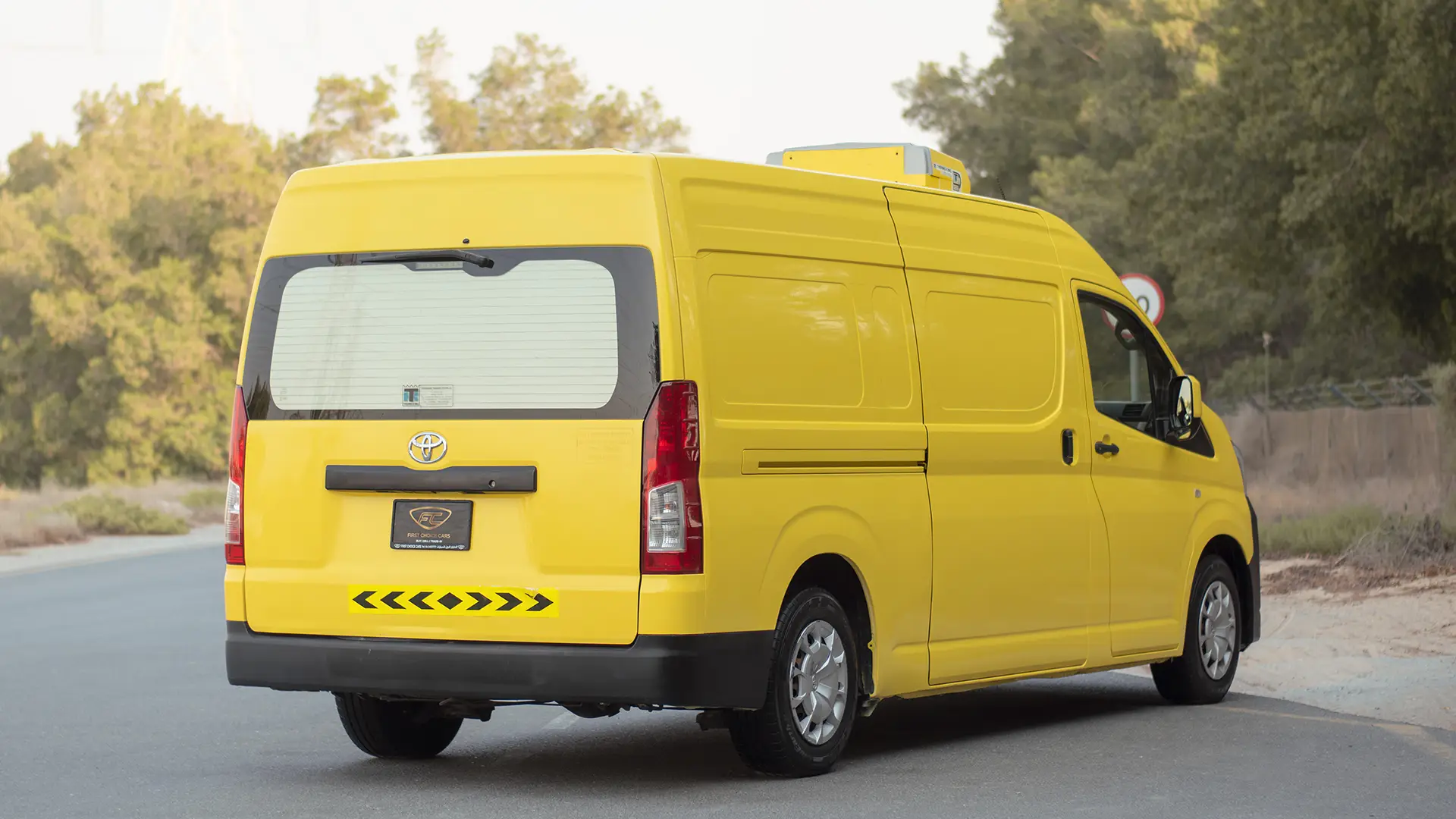 Used 2020 Toyota Hiace GLX High Roof in Yellow – Right Back Diagonal (45°) View for Sale at First Choice Cars Dubai Sharjah