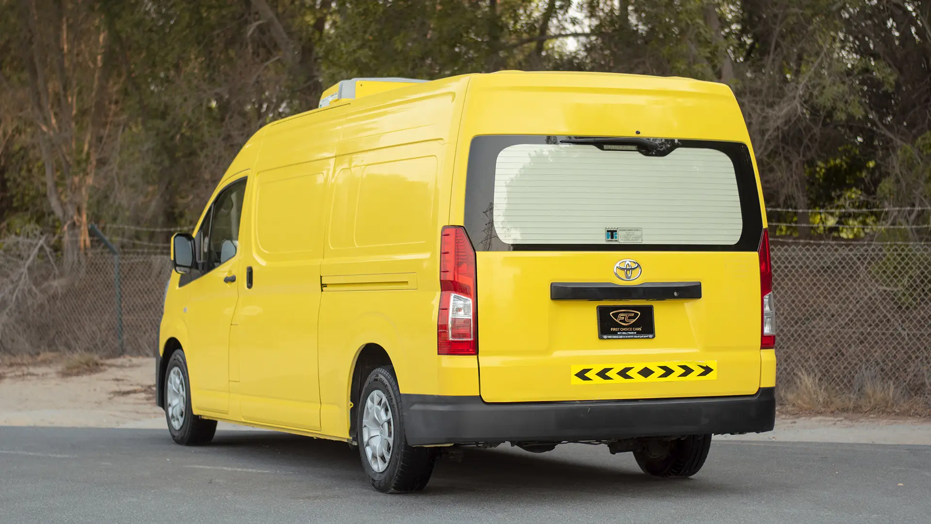 Used 2020 Toyota Hiace GLX High Roof in Yellow – Left Back Diagonal (45°) View for Sale at First Choice Cars Dubai Sharjah