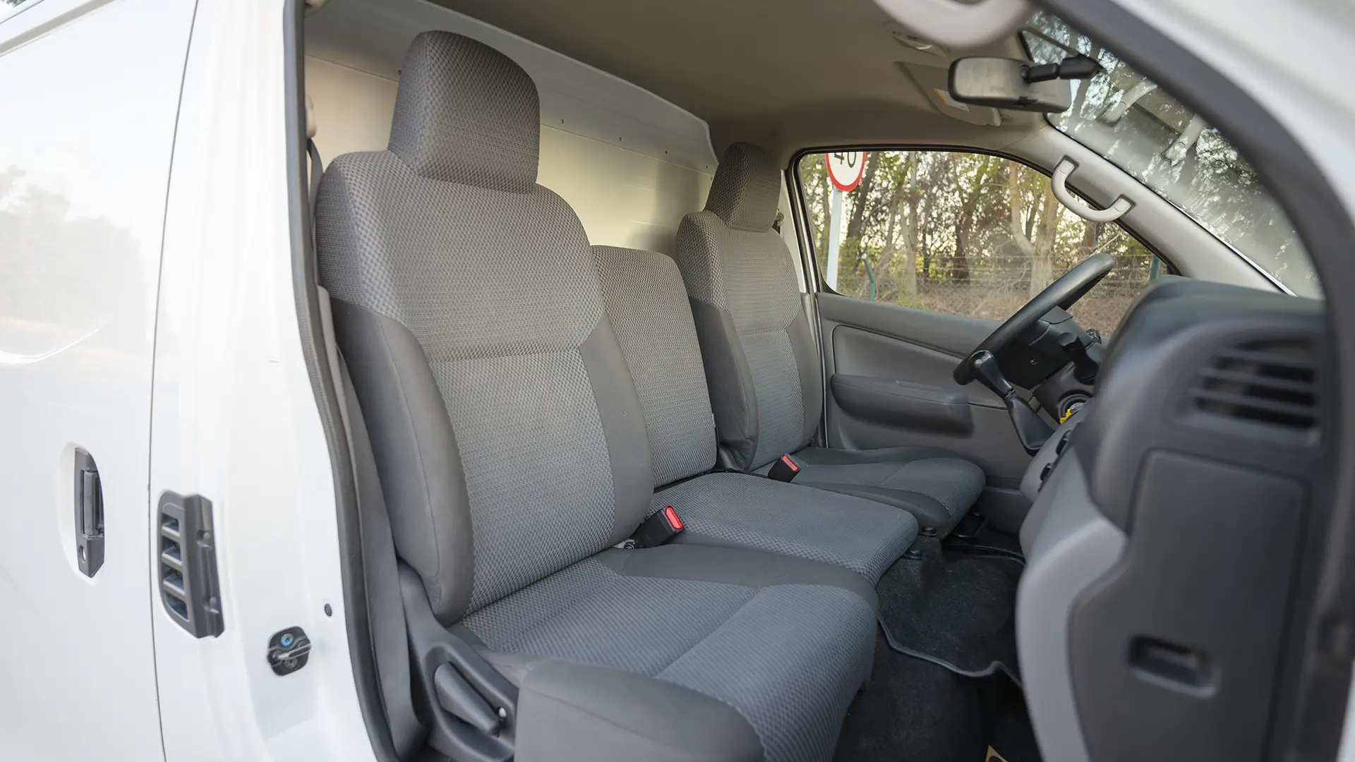 Used 2022 Nissan Urvan Standard Roof in White – Front Passenger Side Cabin View for Sale at First Choice Cars Dubai Sharjah