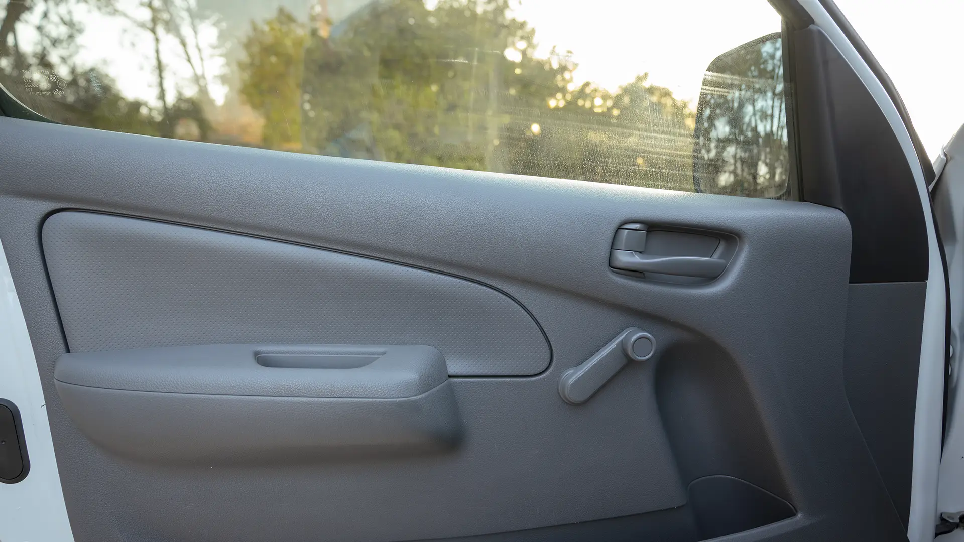 Used 2022 Nissan Urvan Standard Roof in White – Driver Door Panel Full View for Sale at First Choice Cars Dubai Sharjah